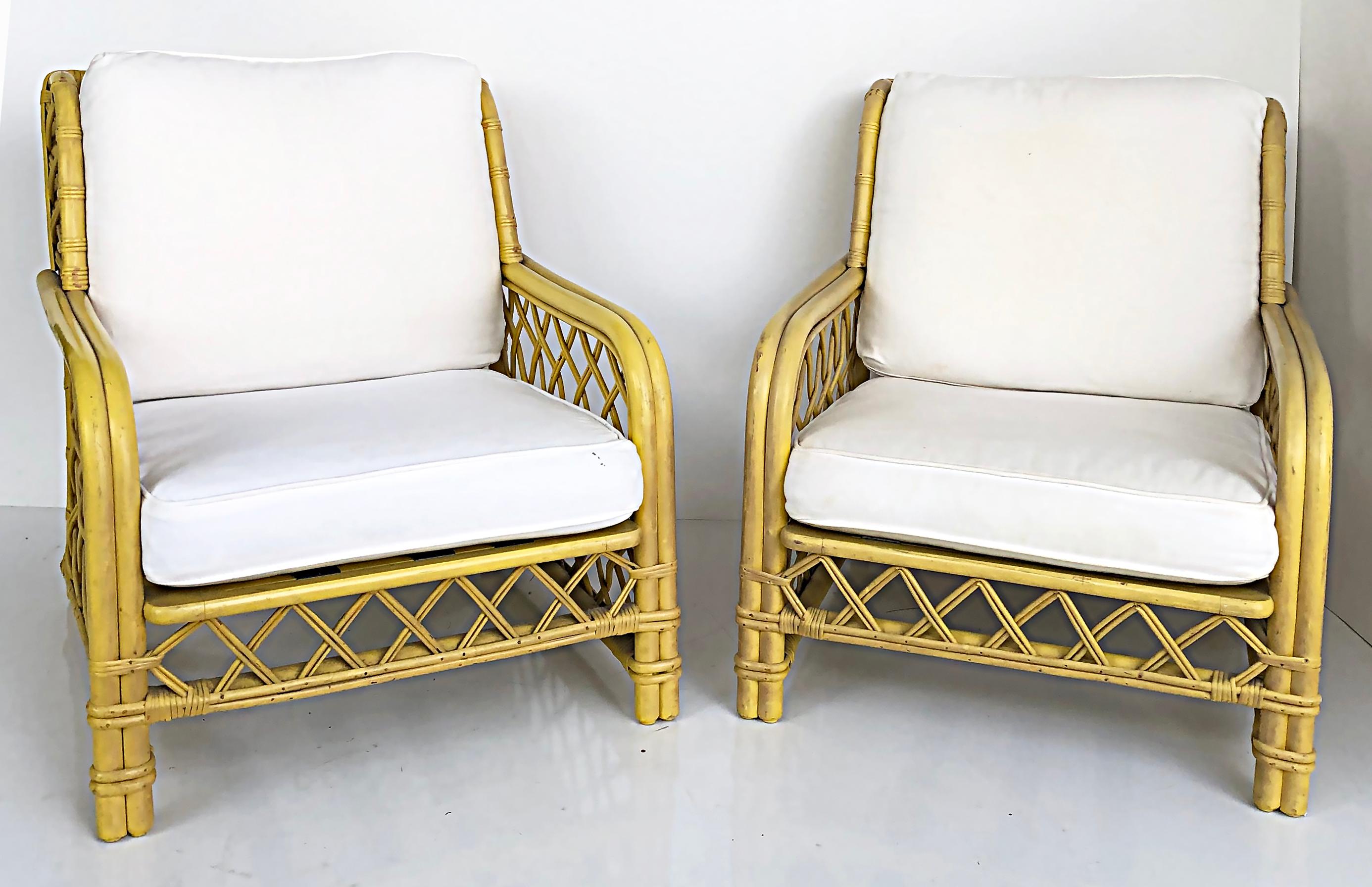 Ficks Reed bent / woven rattan upholstered lounge chairs

Offered for sale is a pair of vintage Ficks Reed lounge chairs with bent rattan frames and woven rattan sides. The chairs are upholstered in canvas and the frames were painted and now have