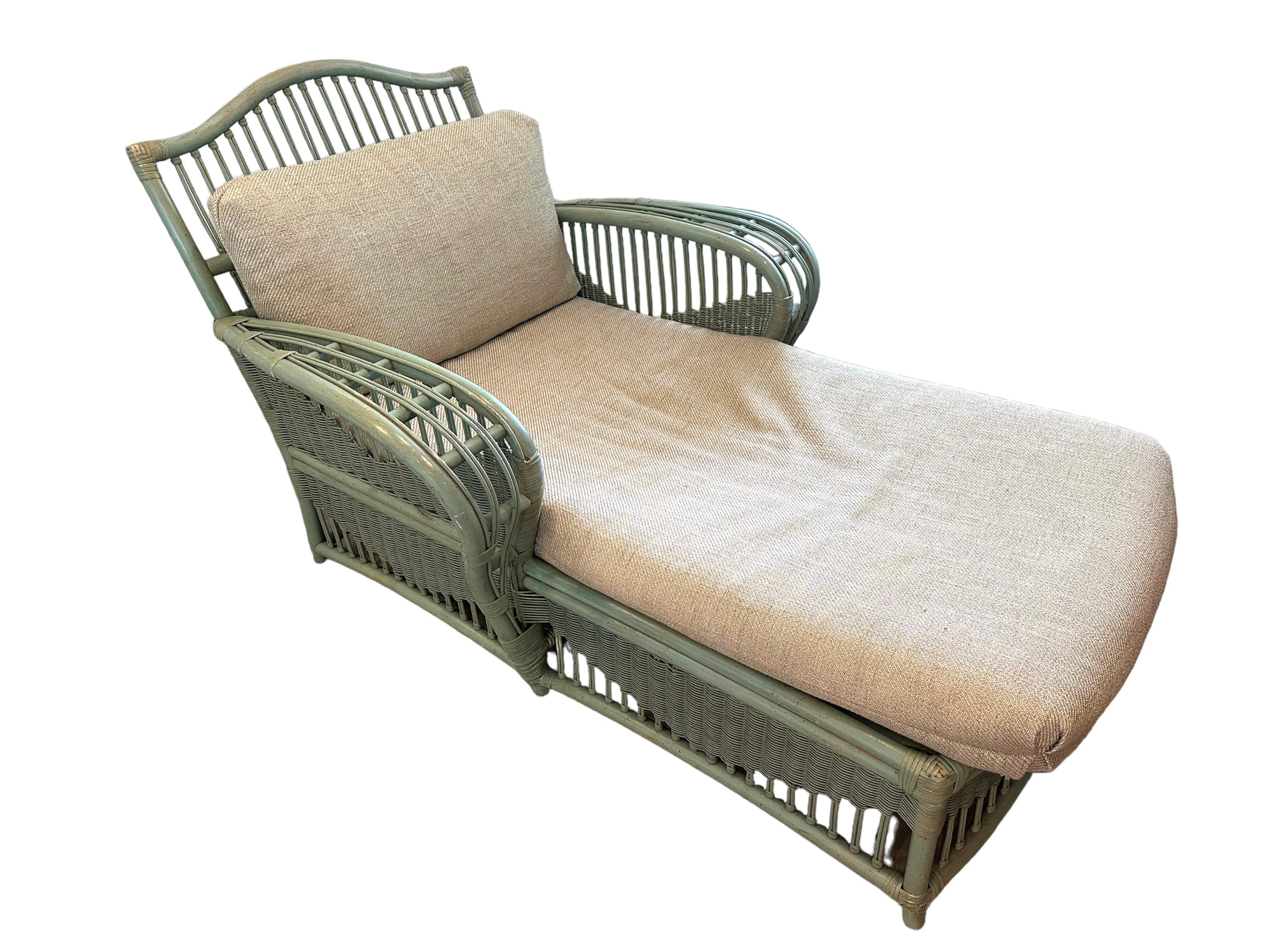 Read notes:
A newly upholstered Ficks  Reed vintage rattan chaise with original pillow but reupholstered, they are very comfortable. Beautiful lines and comfort, some wear to paint. A classic celadon green.

The colorful striped pillow “is not