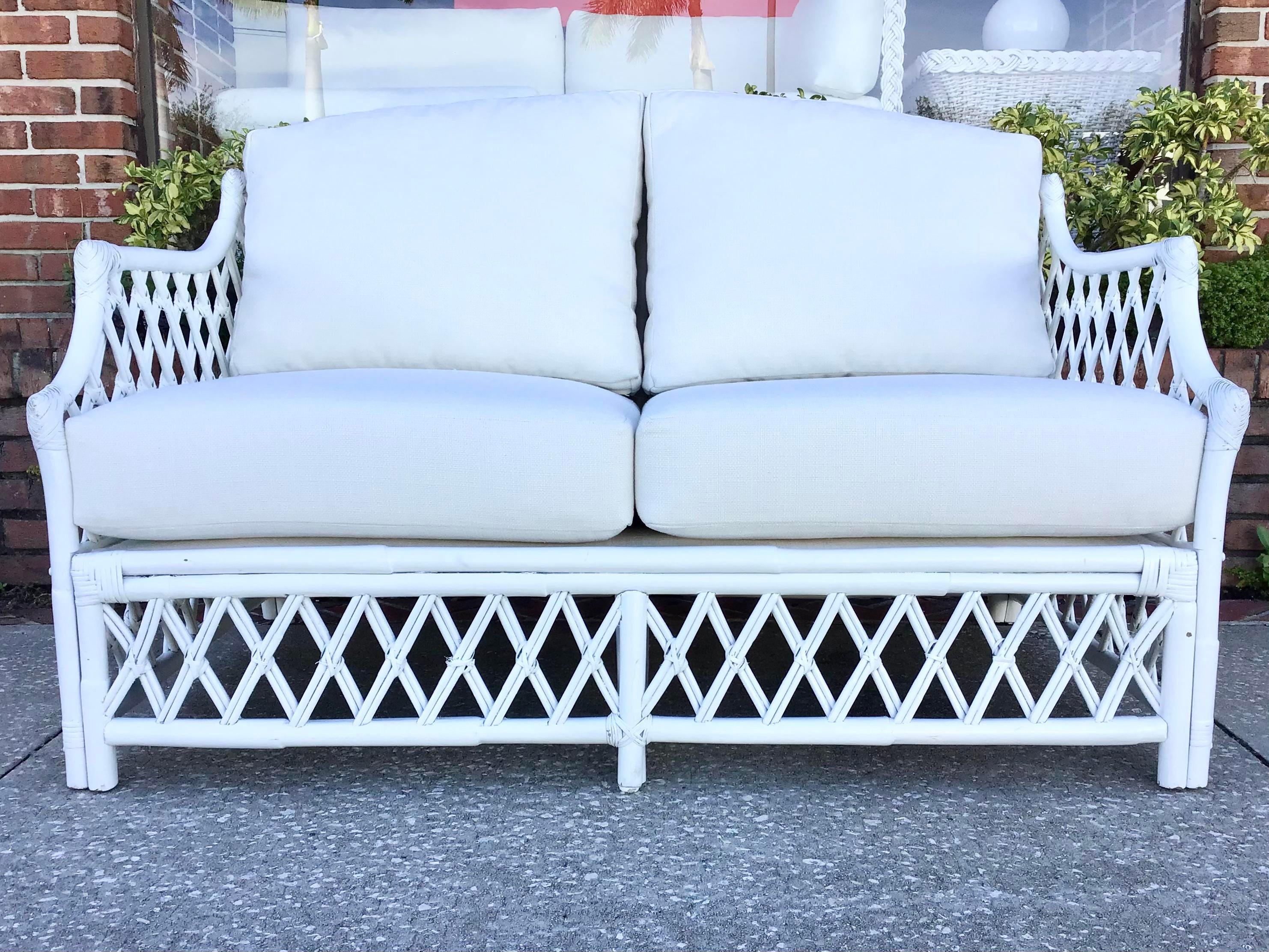 Fantastic Boho Chic Ficks Reed petite rattan loveseat freshly lacquered in white and new Todd Hase upholstered cushions. This would be a great addition to your Boho Chic inspired home.