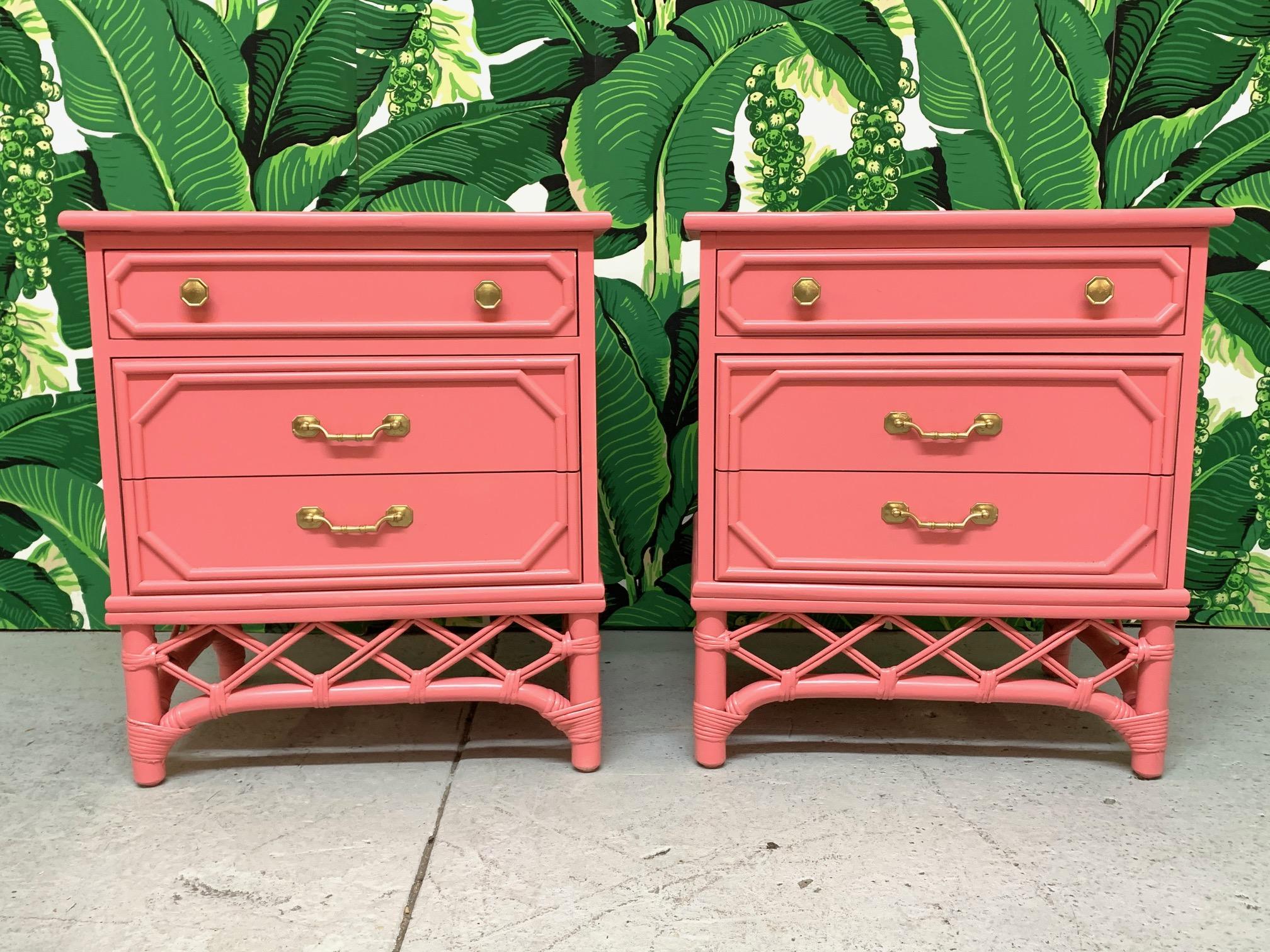 Pair of Ficks Reed nightstands features rattan detailing and newly lacquered gloss pink finish. Faux bamboo on drawer faces and gold hardware. Very good condition with minor imperfections to the newly lacquered finish.