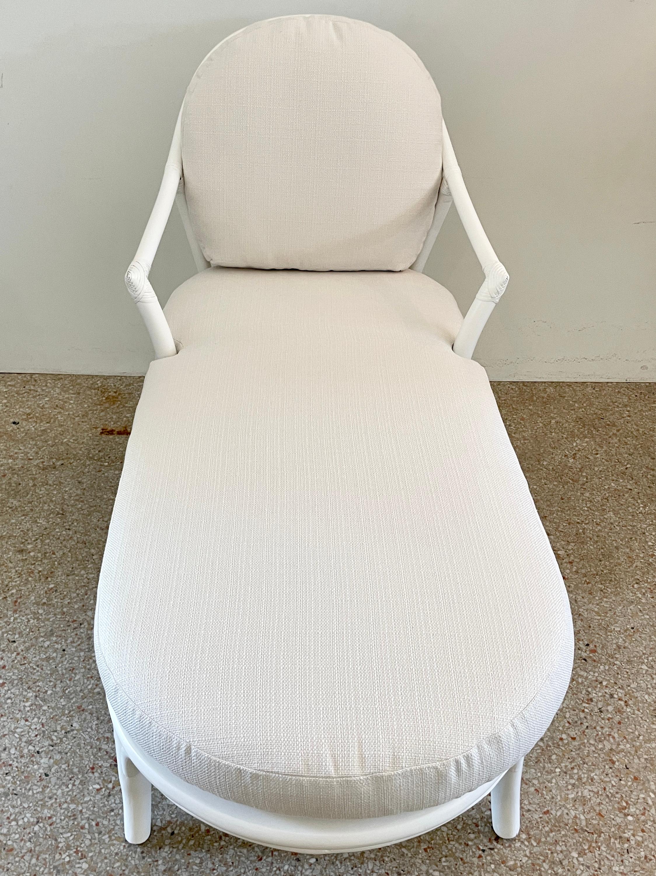Beautiful boho chic Ficks Reed rattan chaise with new Todd Hase textiles cushions. Frame seat is made with cane and freshly lacquered in white. Great addition to your boho chic inspired interiors. We have two available! Upholstered in Todd Hase High
