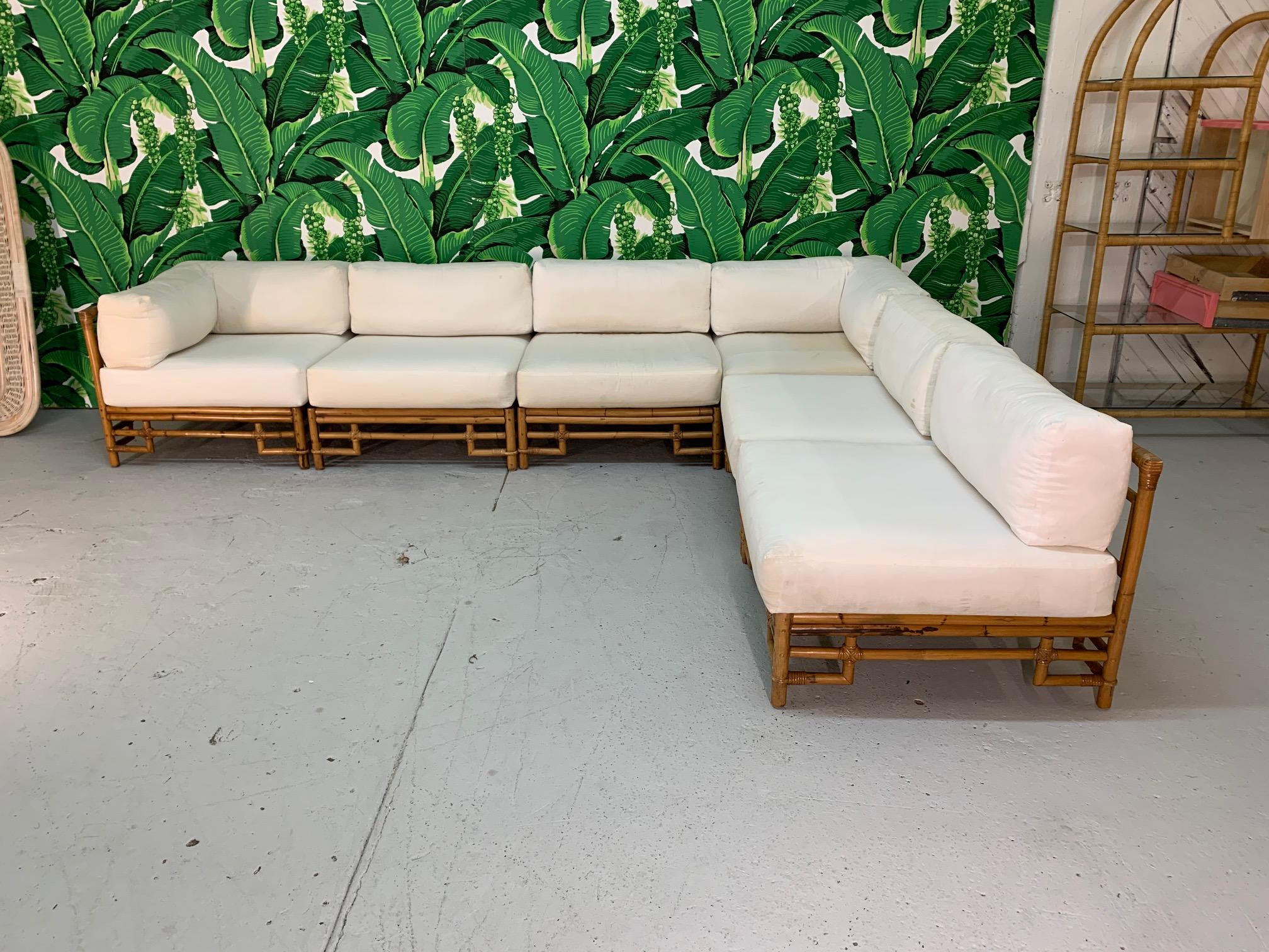 Large six piece modular sectional sofa by Ficks Reed features rattan frame and chinoiserie style design. Cushions are muslin covered and ready for your upholstery. We offer custom upholstery services as well. Very good condition, structurally very