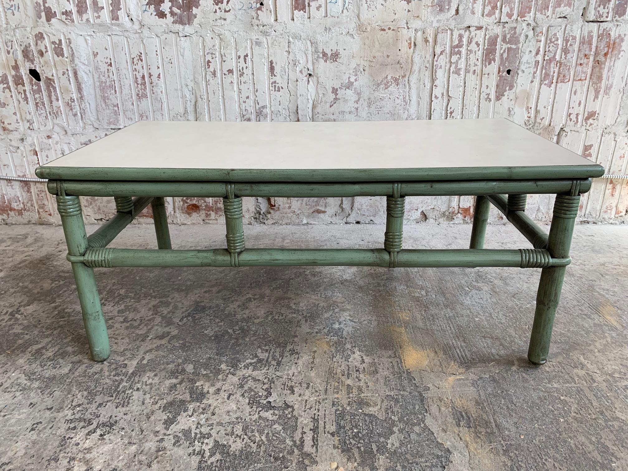 Midcentury rattan bamboo coffee table by Ficks Reed features a gorgeous green frame and a perfect amount of patina from age. Very good vintage condition. We also have other matching pieces, just check our other listings.