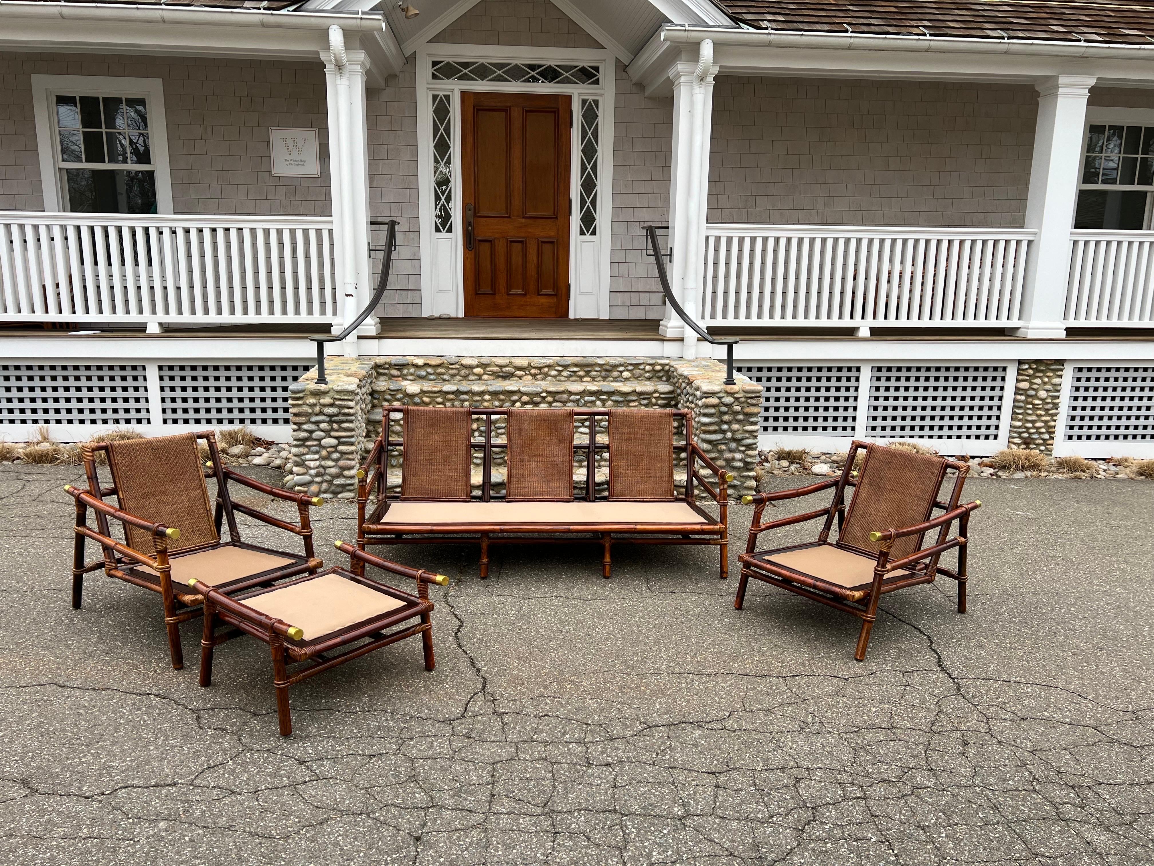 This is a four piece midcentury Ficks Reed rattan set designed by John Wisner for the Far Horizons collection. The pieces are in very good condition. They have been cleaned and restored. This is a highly desirable midcentury set for its style and