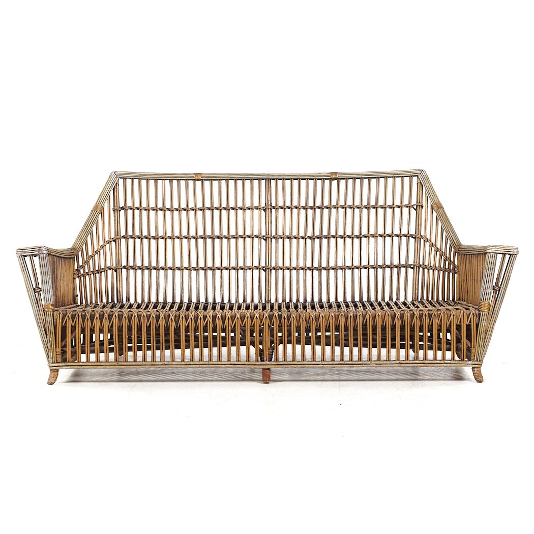 Ficks Reed Style Mid Century Rattan Settee

This settee measures: 70.5 wide x 34 deep x 30.5 inches high, with a seat height of 10.5 and arm height of 19.75 inches

All pieces of furniture can be had in what we call restored vintage condition. That