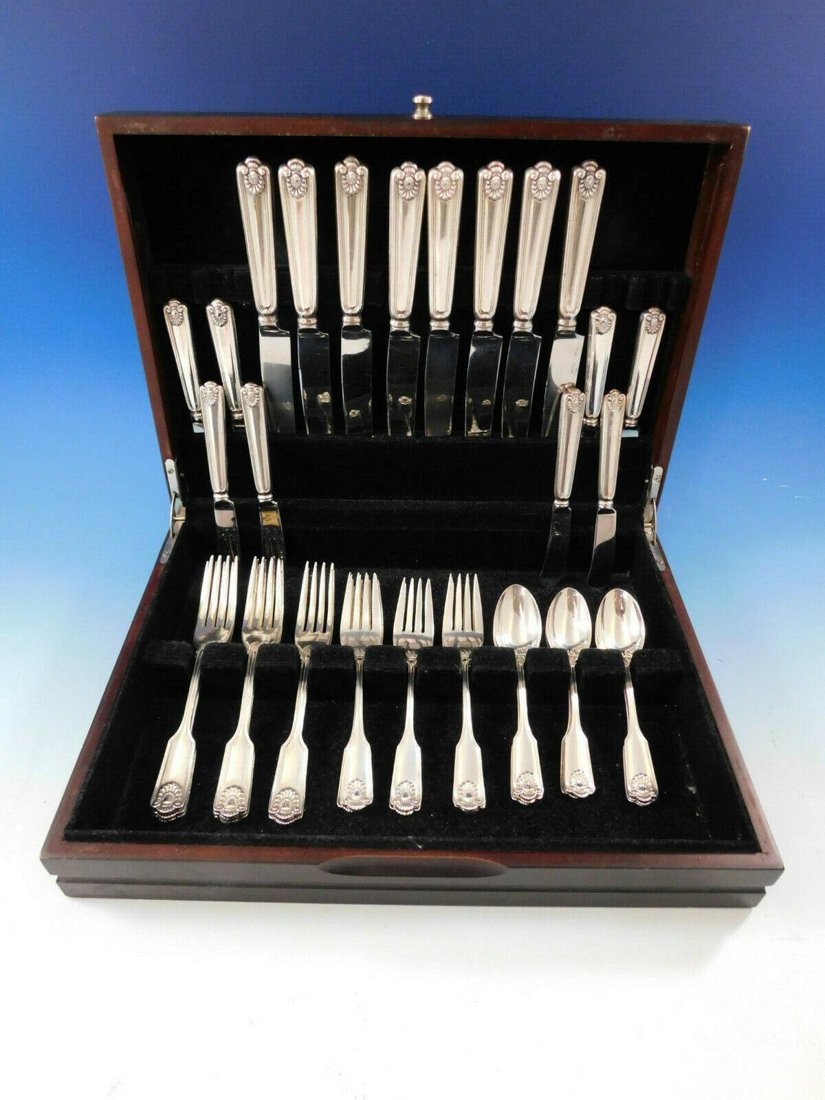 Dinner size Fiddle Shell by Frank Smith sterling silver flatware set, 40 pieces. Dinner size in this pattern is especially scarce. This popular Classic pattern was first offered in 1914 and was discontinued in 2003. This set includes:

 8 dinner