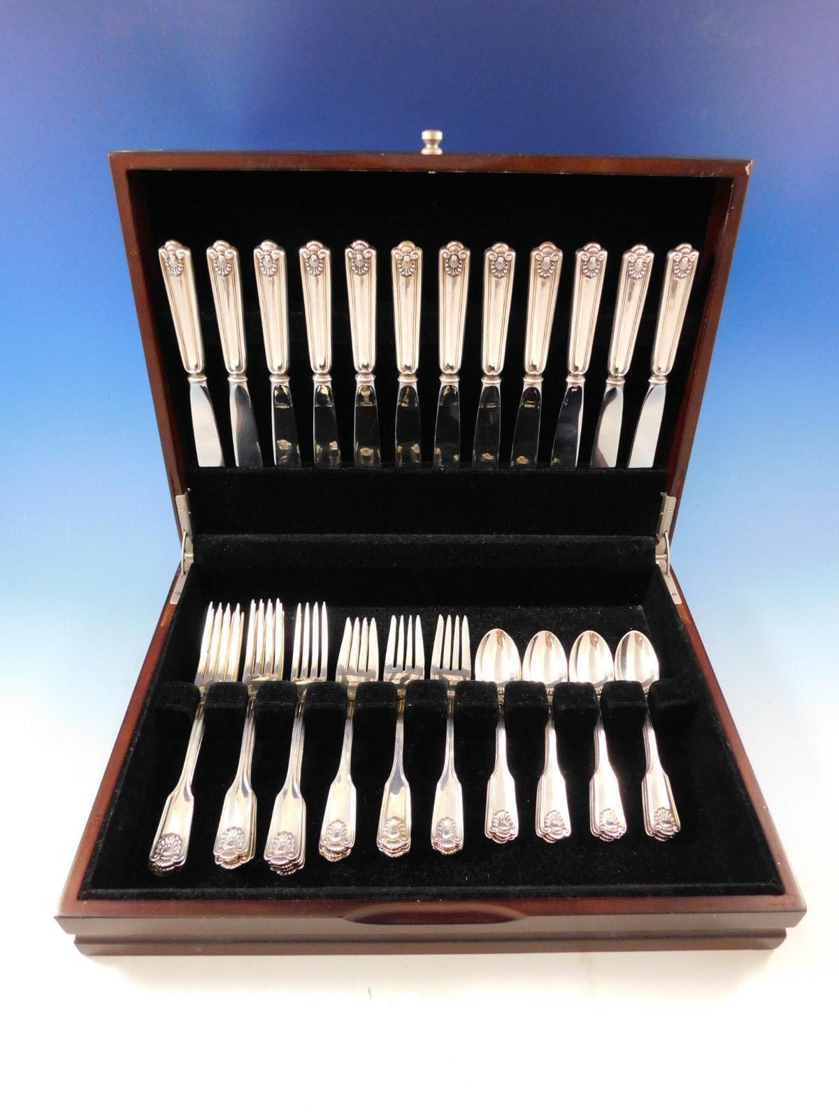Fiddle shell by Frank Smith sterling silver flatware set, 48 pieces. This set includes:

12 knives, 8 5/8