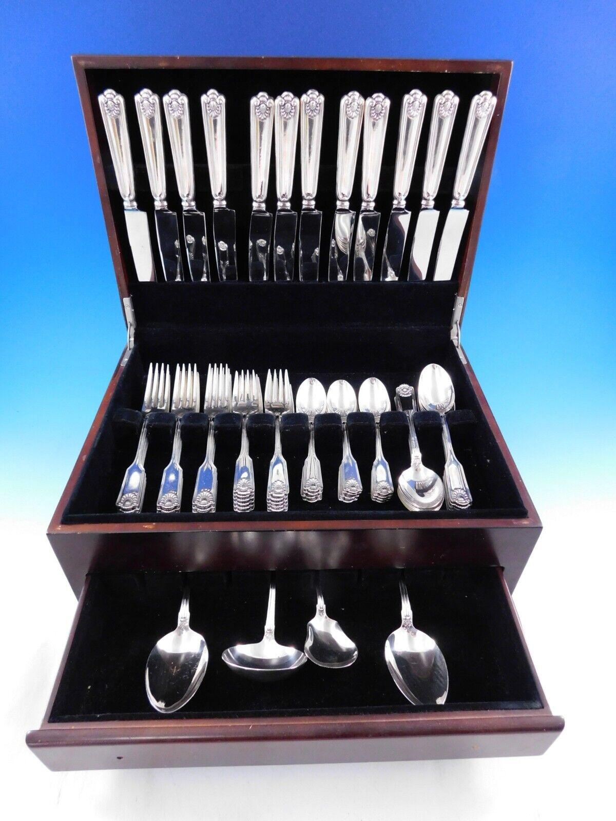 Dinner Size Fiddle Shell by Frank Smith Sterling Silver flatware set, 64 pieces. This popular classic pattern was introduced in the year 1914. This set includes:

12 Dinner Size Knives w/ French stainless blades, 9 5/8