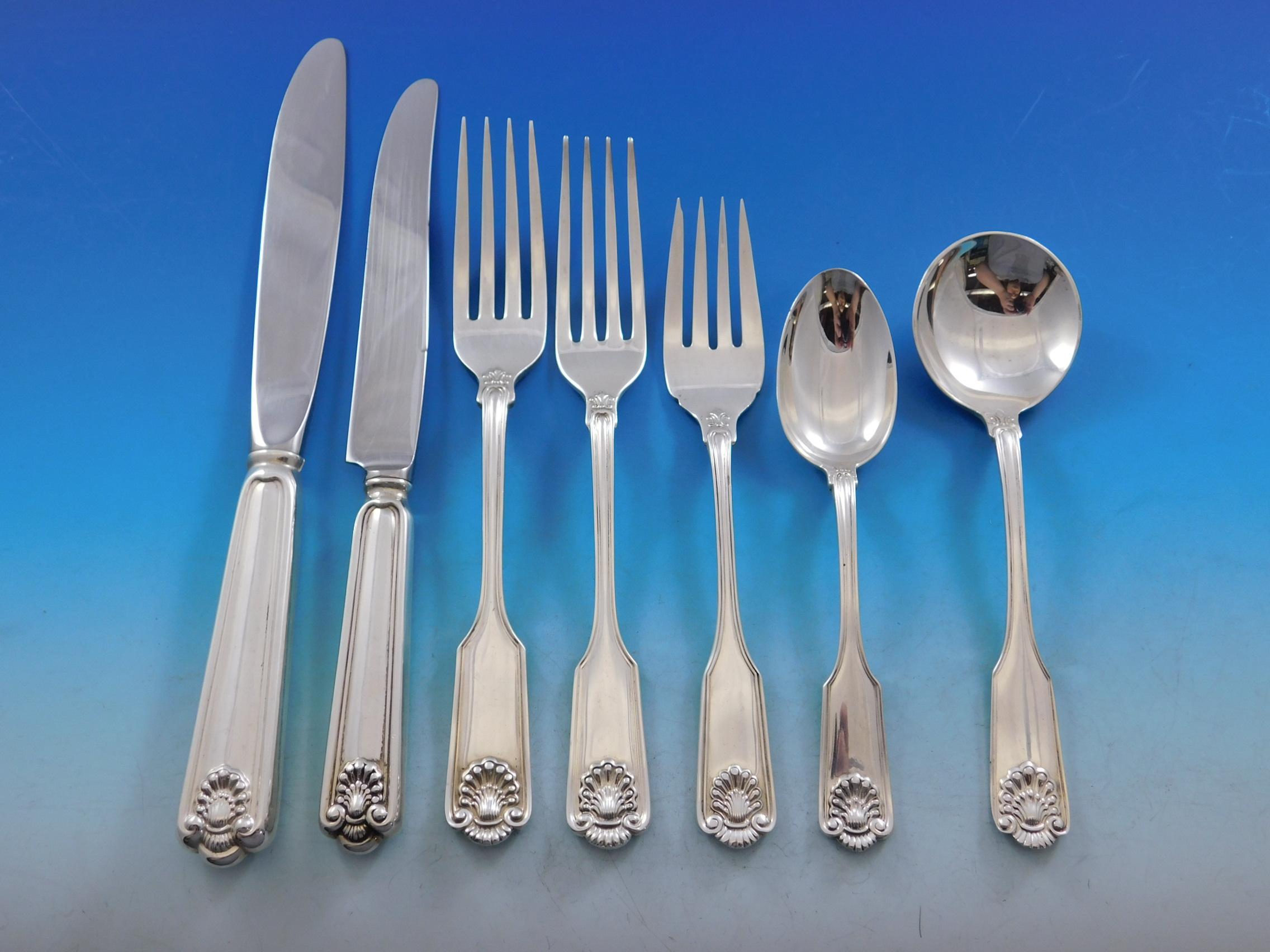 Exquisite Fiddle Shell by Frank Smith sterling silver flatware set, 84 pieces. This popular Classic pattern was first offered in 1914 and was discontinued in 2003. This set includes:

12 dinner size knives, modern blades, 9 3/8