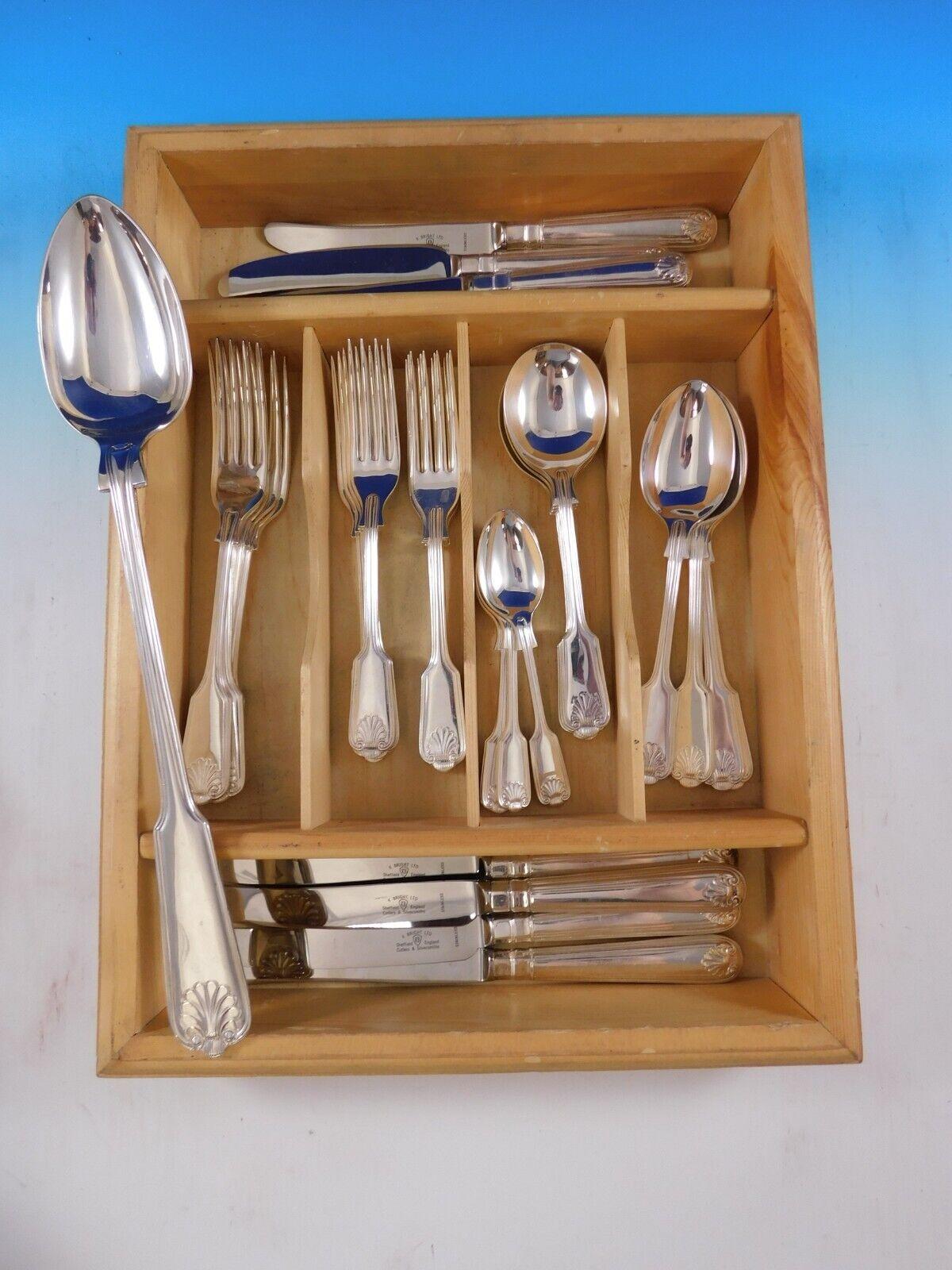 Fiddle Shell by Kenneth Bright English Silverplated Flatware set, 33 pieces. This set includes:

4 Large Dinner Size Knives, 10