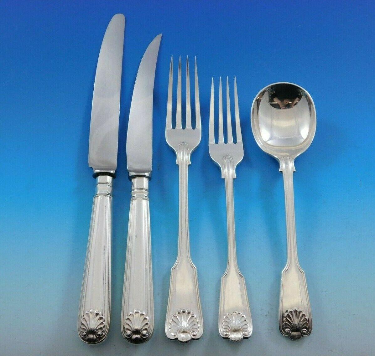 Superb dinner size fiddle thread and shell by James Robinson Sterling Silver Flatware set, 48 pieces. This set includes:

8 dinner size knives, 9 1/2