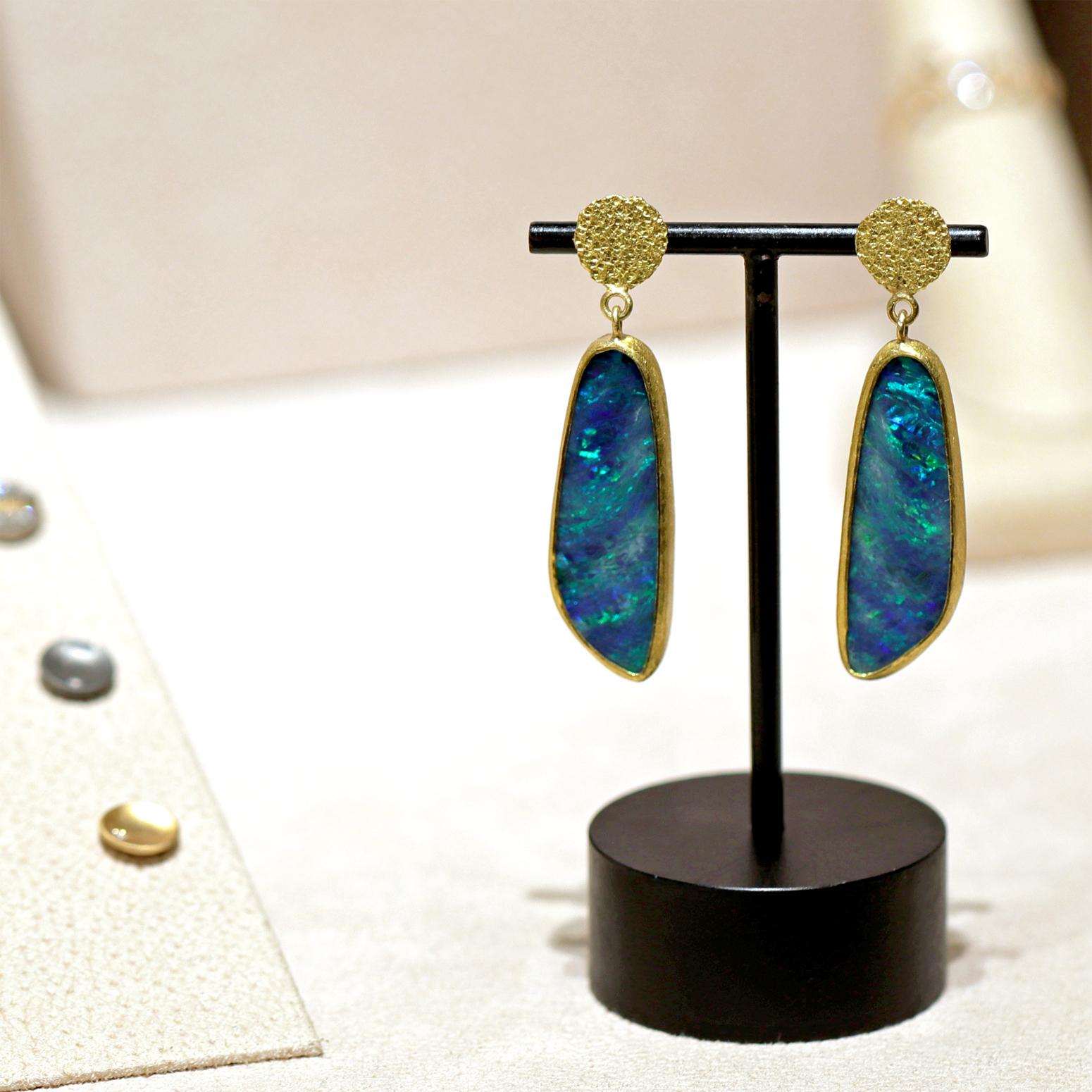 Earrings handcrafted by acclaimed jewelry maker Petra Class featuring a fabulous matched pair of deep blue Australian opal doublet with strong electric green fire complemented by flashes of blue and violet, bezel-set in Petra's intricately-textured
