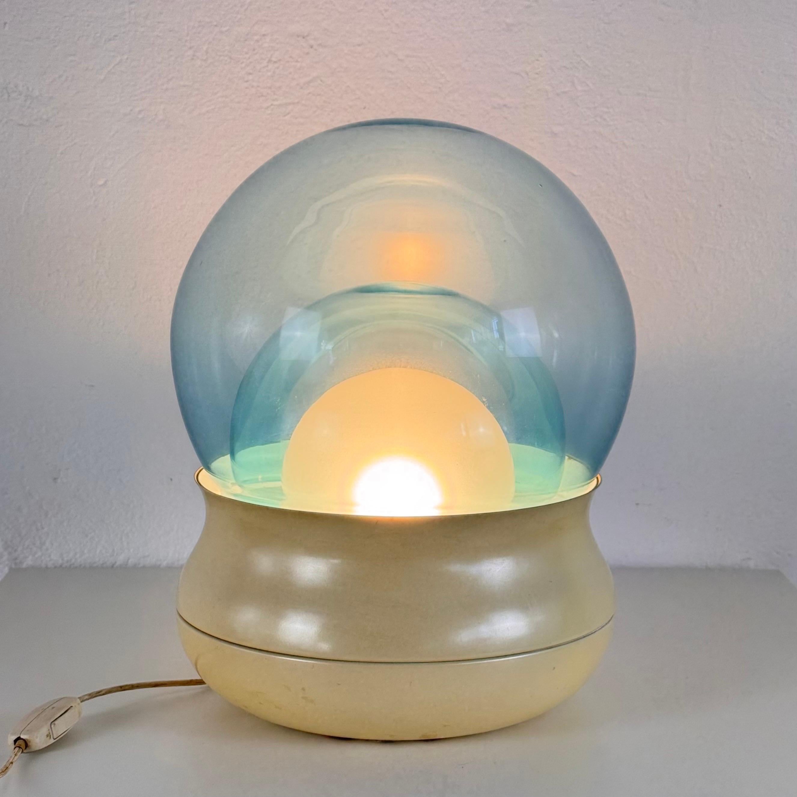 A rare and visually striking table lamp model “Fiesta” designed by Giorgio Longoni for Stilnovo, Italy, 1970s.

This hypnotic lamp features three stacked spheres — two in deep cobalt blue glass with a central white glass orb — set into a sculpted