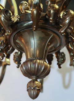 Fifteen-Light Neoclassical Bronze Chandelier with an Antique Gold Finish