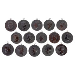 Fifteen medallions with profile portraits. Hard wood, metal. 19th century.