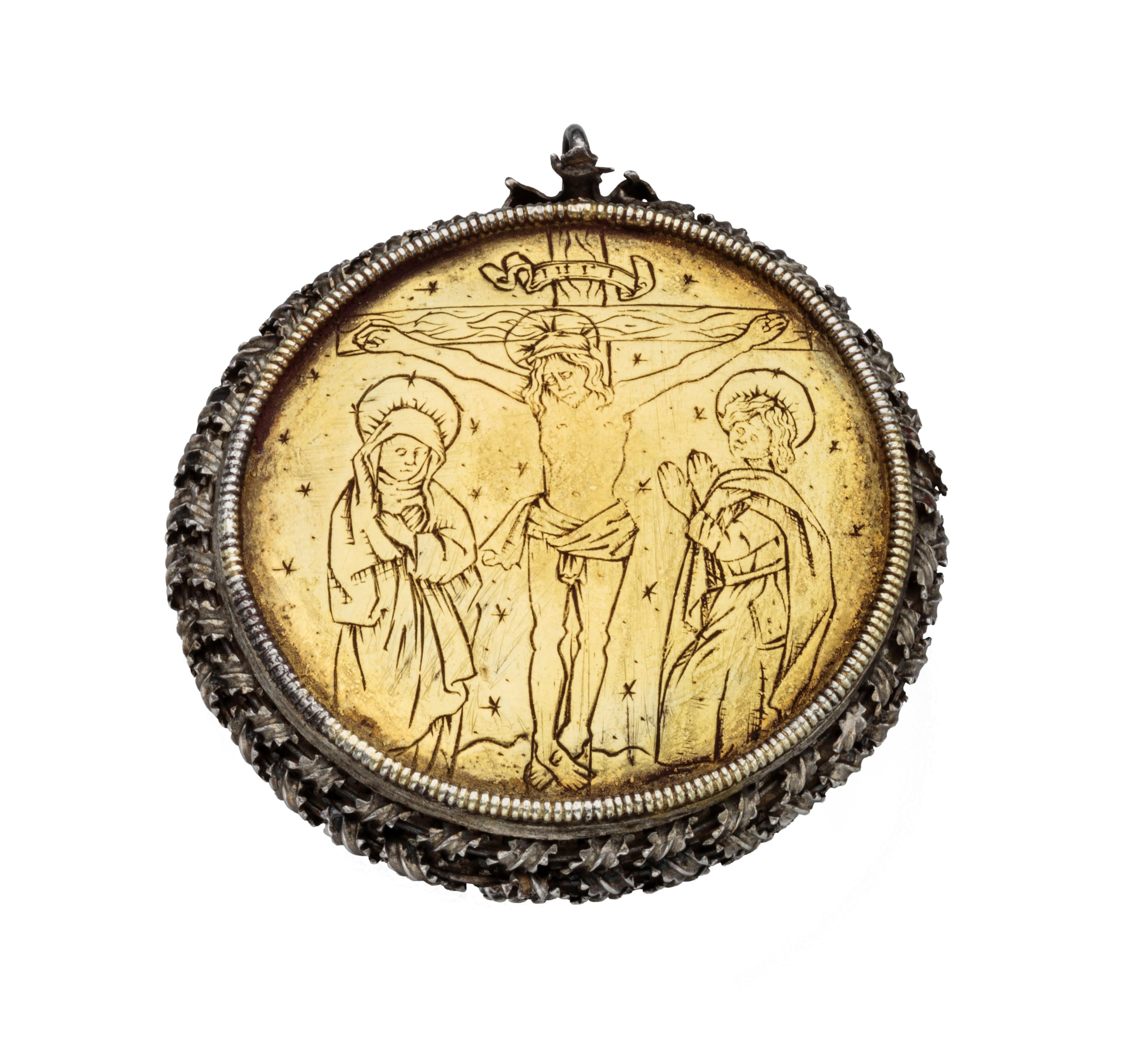Reliquary Pendant with St. Catherine
Capsule: Transylvania; medallion: Germany, c. 1475–1500 
Silver, gilded silver 
Weight 49.6 grams; dimensions 57 × 51 × 18 mm, opens to 72 mm 

The surfaces of this small reliquary pendant create a delightful