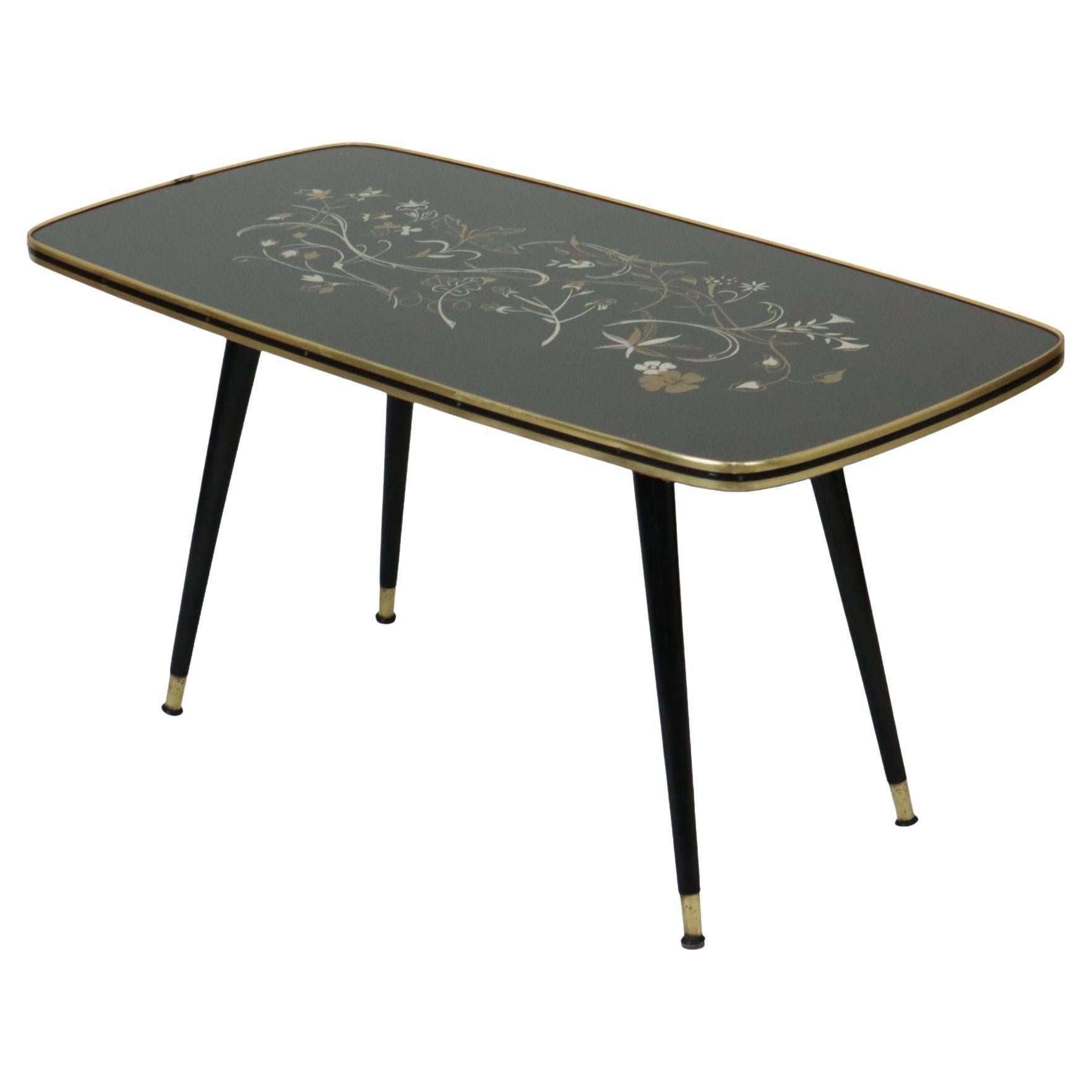 Table basse Rockabilly des années 50 Pieds coniques Plateau en verre Motif floral