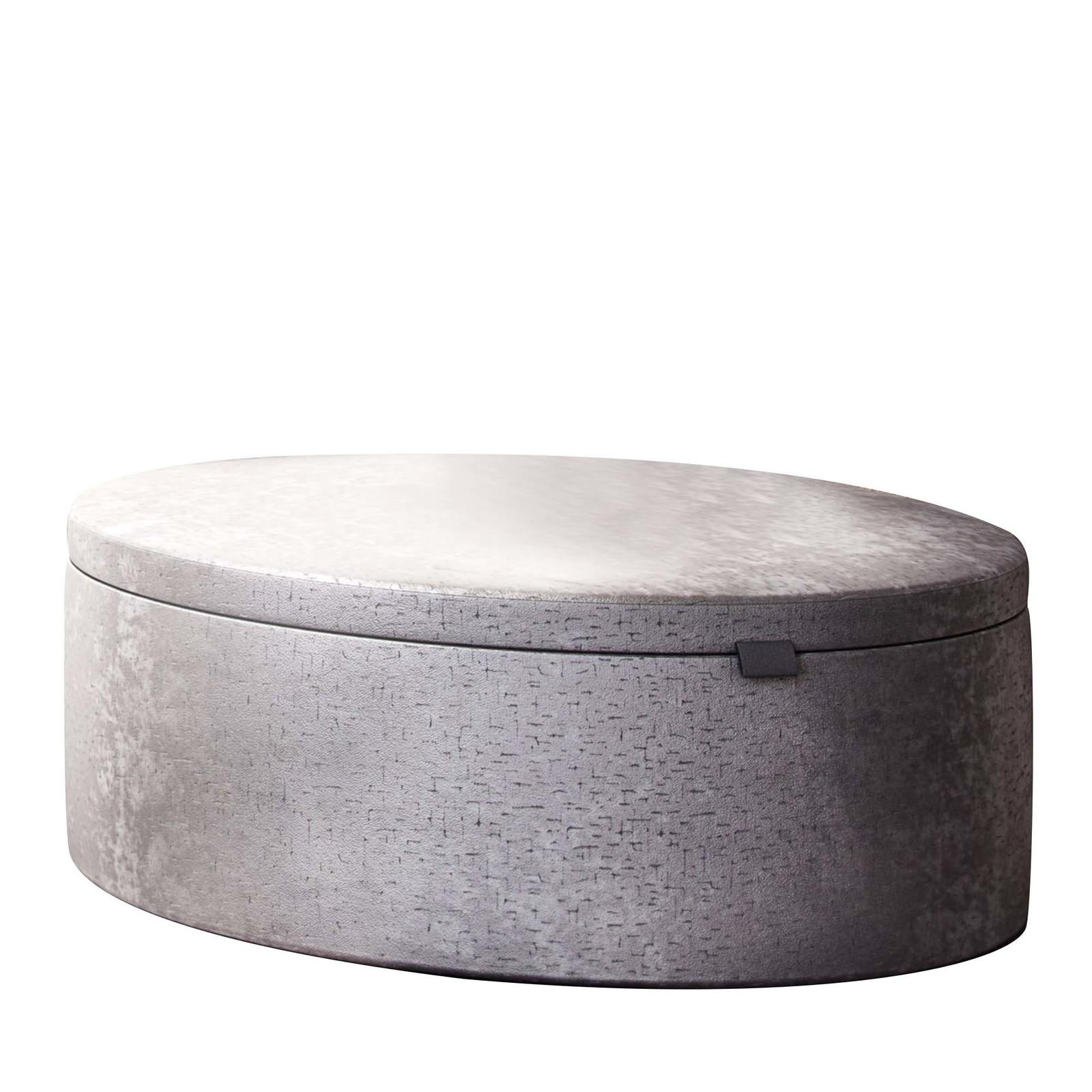 This versatile and stylish pouf boasts a linear silhouette comprising a structure in curved poplar plywood. Maximum comfort is provided by multi-density polyurethane padding upholstered throughout with a proprietary luxury fabric in gray. The top
