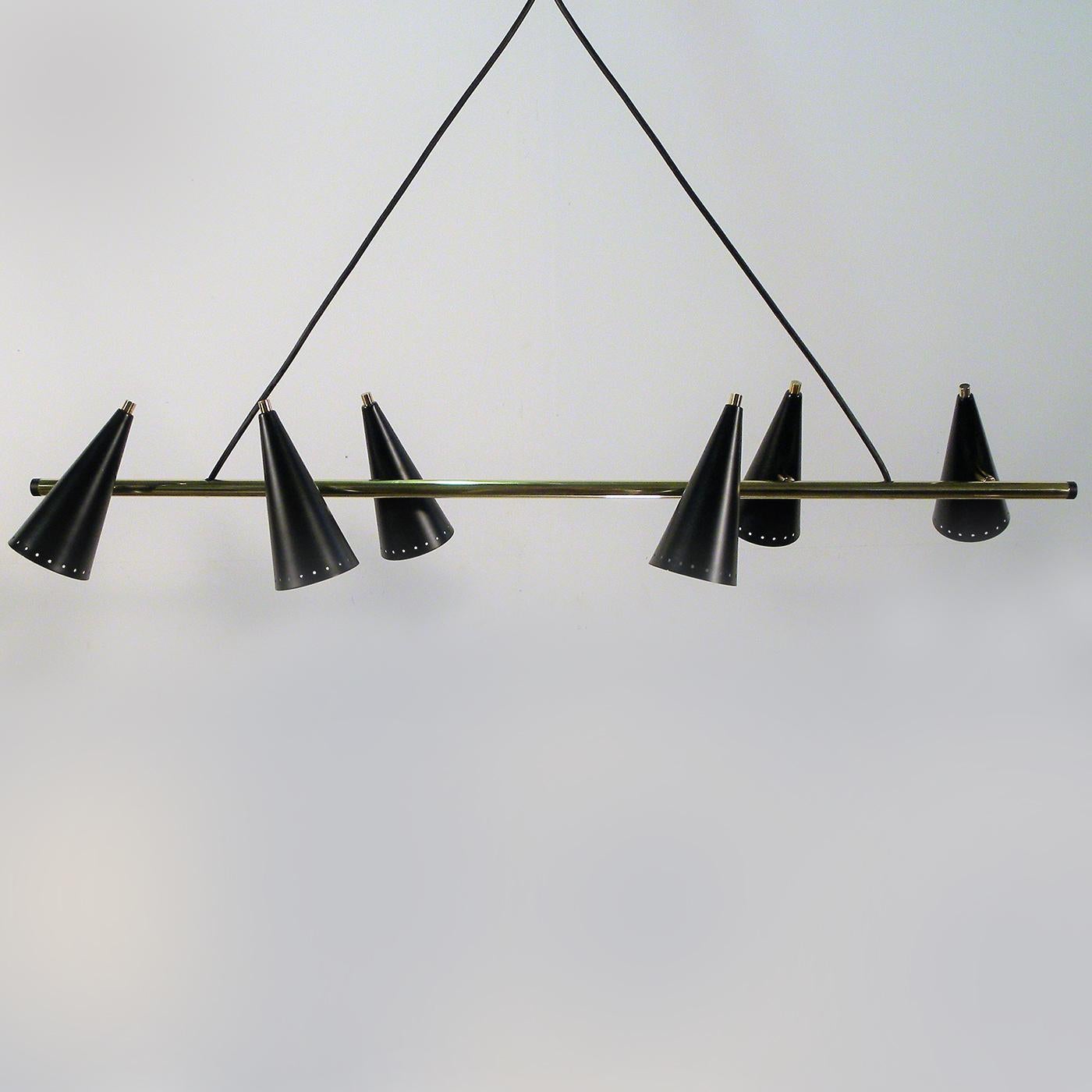 Part of the whimsical Fiftyes collection, inspired by the elegance and charm of the Italian 1950s style, this chandelier features a geometric and Minimalist structure in black-lacquered metal with details in brass. Six conical metal shades of