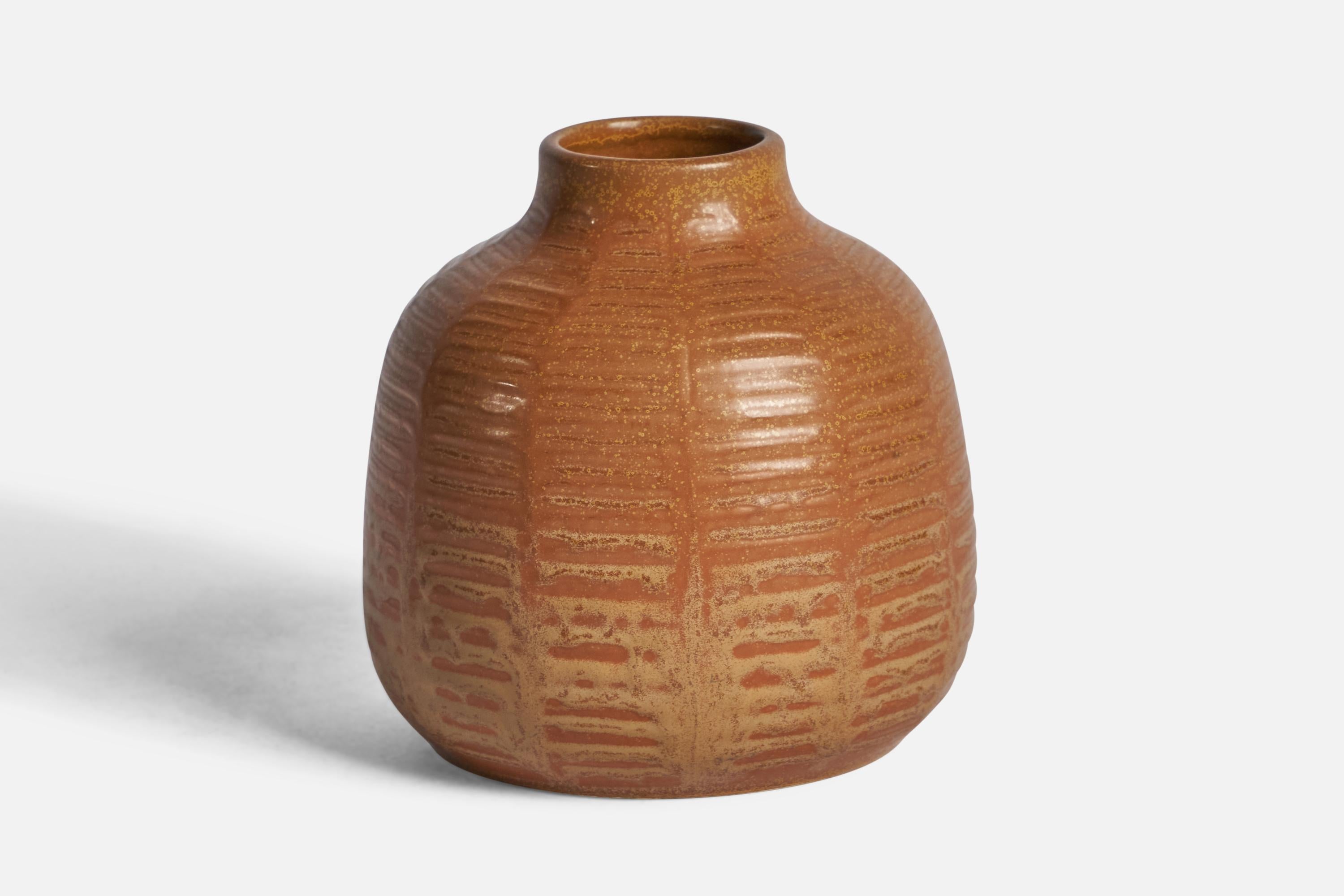 A brown-glazed and incised stoneware vase designed and produced by Figgjo Fajanse, Norway, 1974.

“FIGGJO FAJANSE — STAVANGERFLINT AS JULEN 1974” on bottom