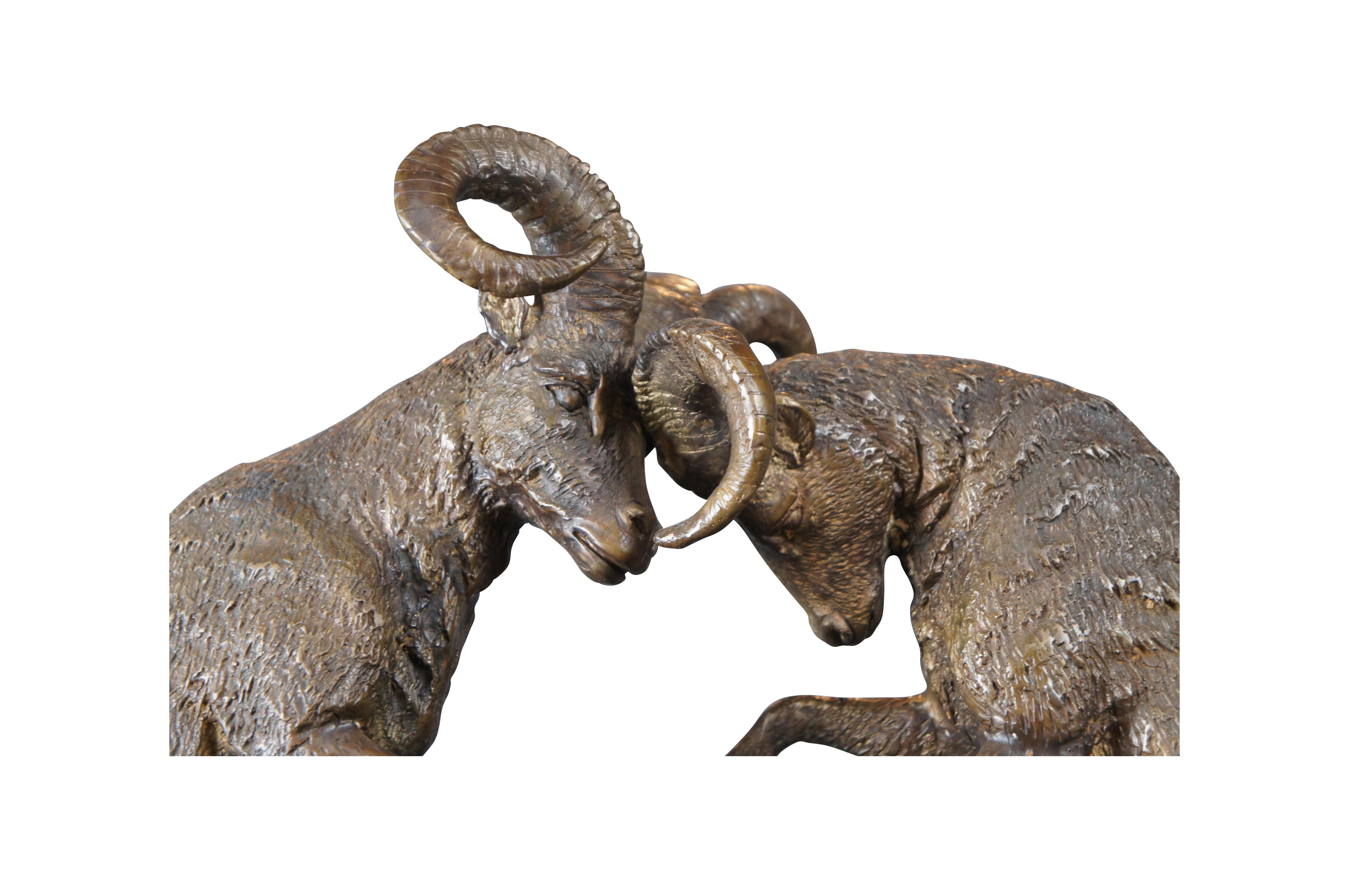 Large Signed Lost Wax Bronze Sculpture of Fighting Rams. Features two bucking / fighting mountain rams. Well detailed with fur, horns, facial features over a marble base. Signature monogram ETL on surface.

Dimensions:
30