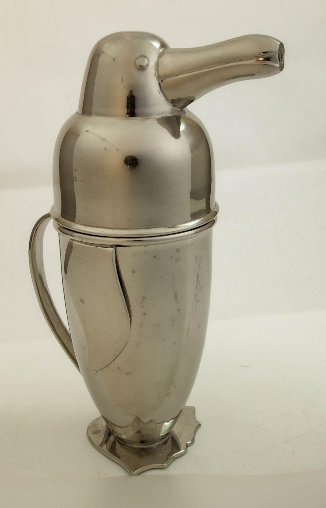 Late 20th century Figural Art Deco Stainless Steel Penguin Cocktail Shaker.
An Art Deco-Style Stainless Figural Cocktail Shaker, in the form of a penguin.
Stainless cocktail shaker in the form of a penguin, after the Napier Art Deco model, c.