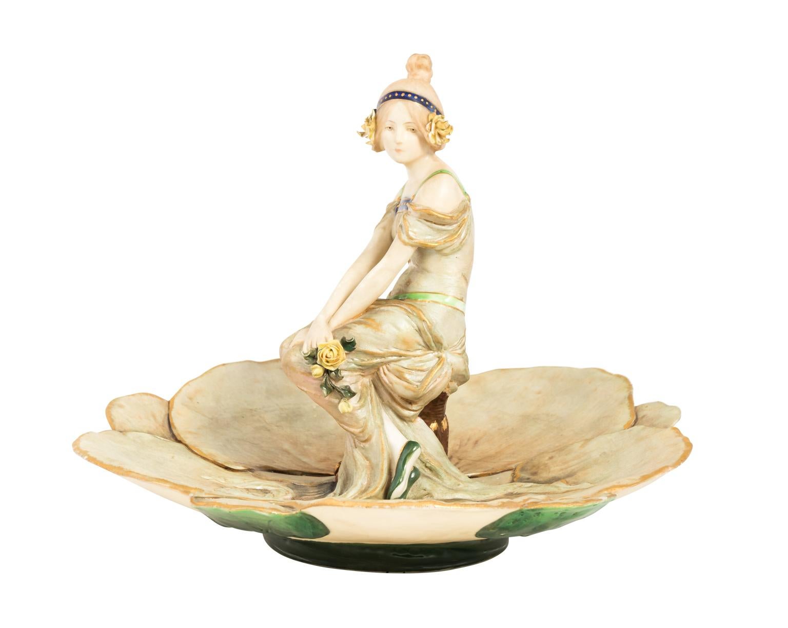 Porcelain figural Art Nouveau style amphora dish from Austria with a layered flower shaped base in a painted finish, circa early 20th century.
 