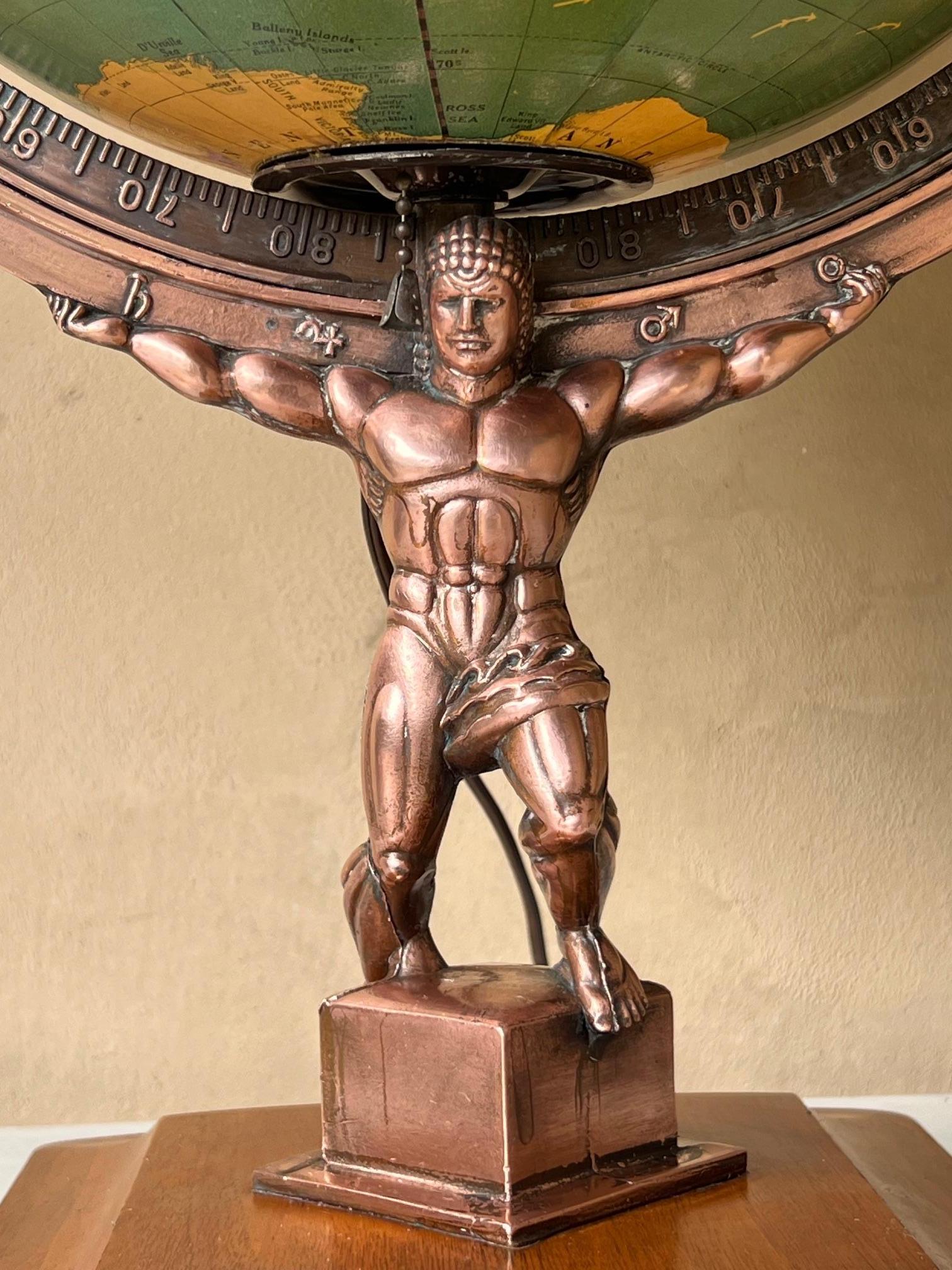 This Art Deco illuminated light in the shape of the globe was made by the George F. Cram Company in the United states in the late 1940's. The base is a copper metal alloy figure of Atlas holding up the globe on a wooden platform. 
The light is in