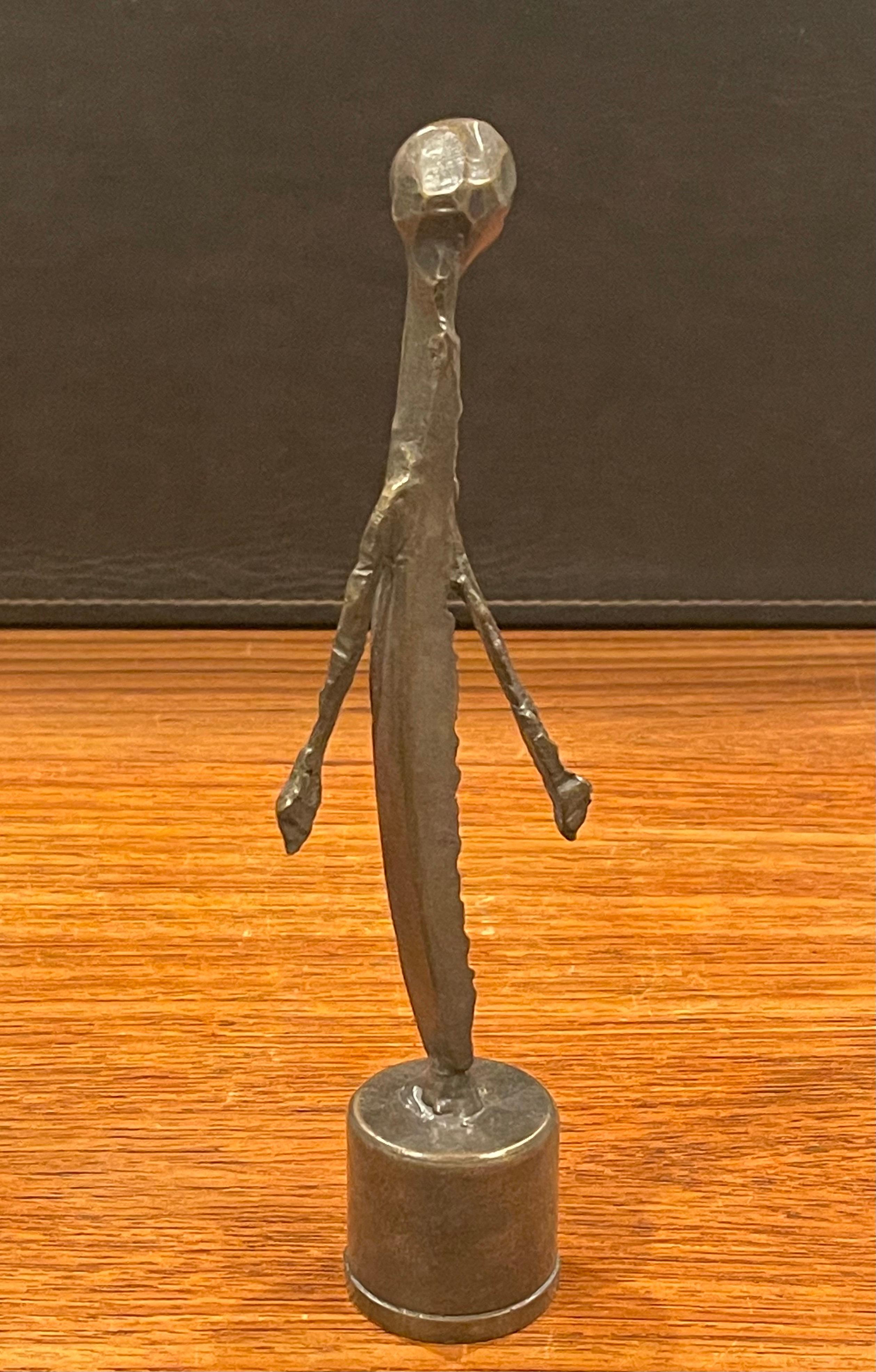 Figural bronze sculpture by Marilyn Kuksht, circa 2000s. The piece is signed on the base and numbered 2/20 on the underside. The sculpture is in in very good condition and measures 1.75