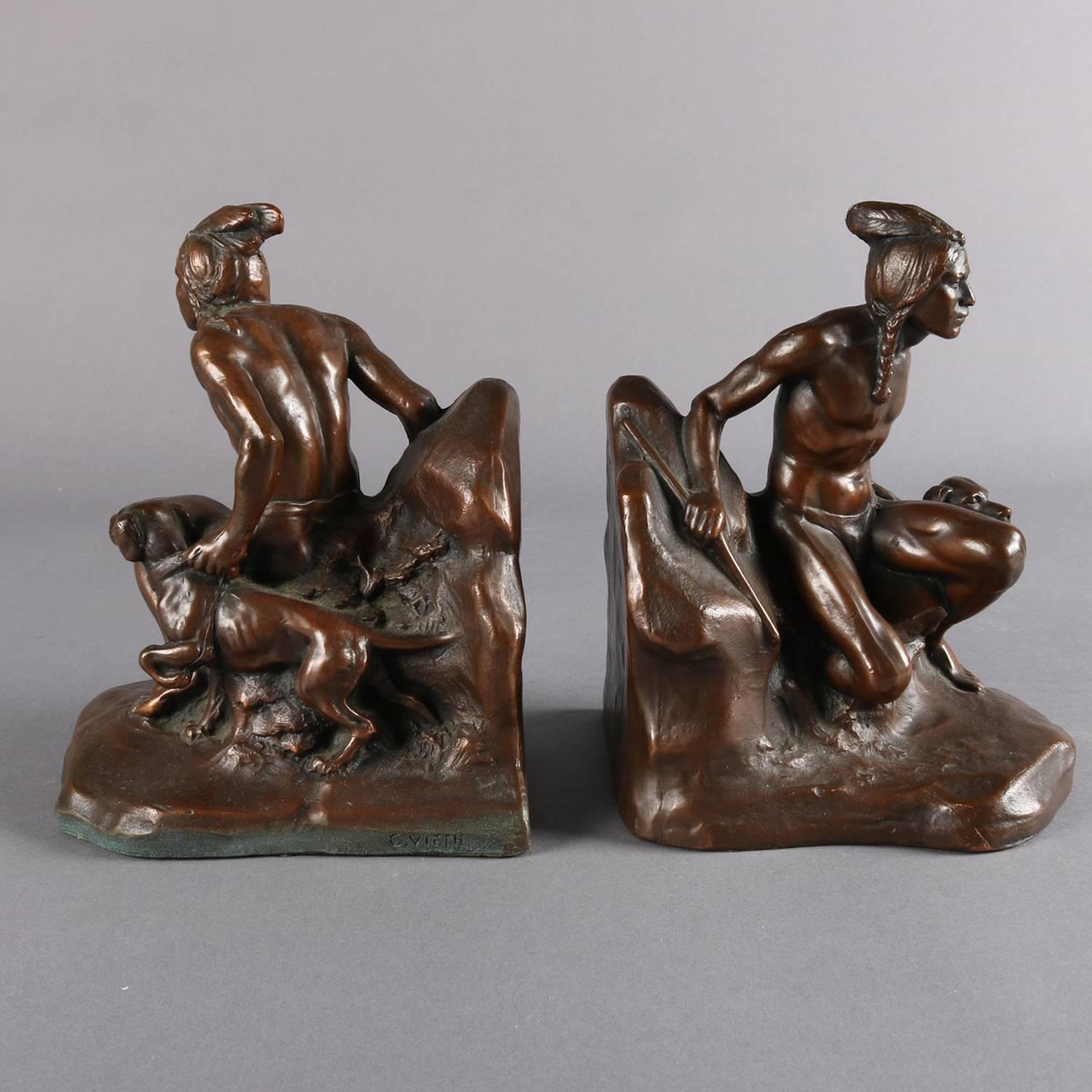 Pair of sculptural bronzed cast metal figural bookends depict Native American Indian man with his dog hunting, signed C. Vieth, 19th century

Measures: 7