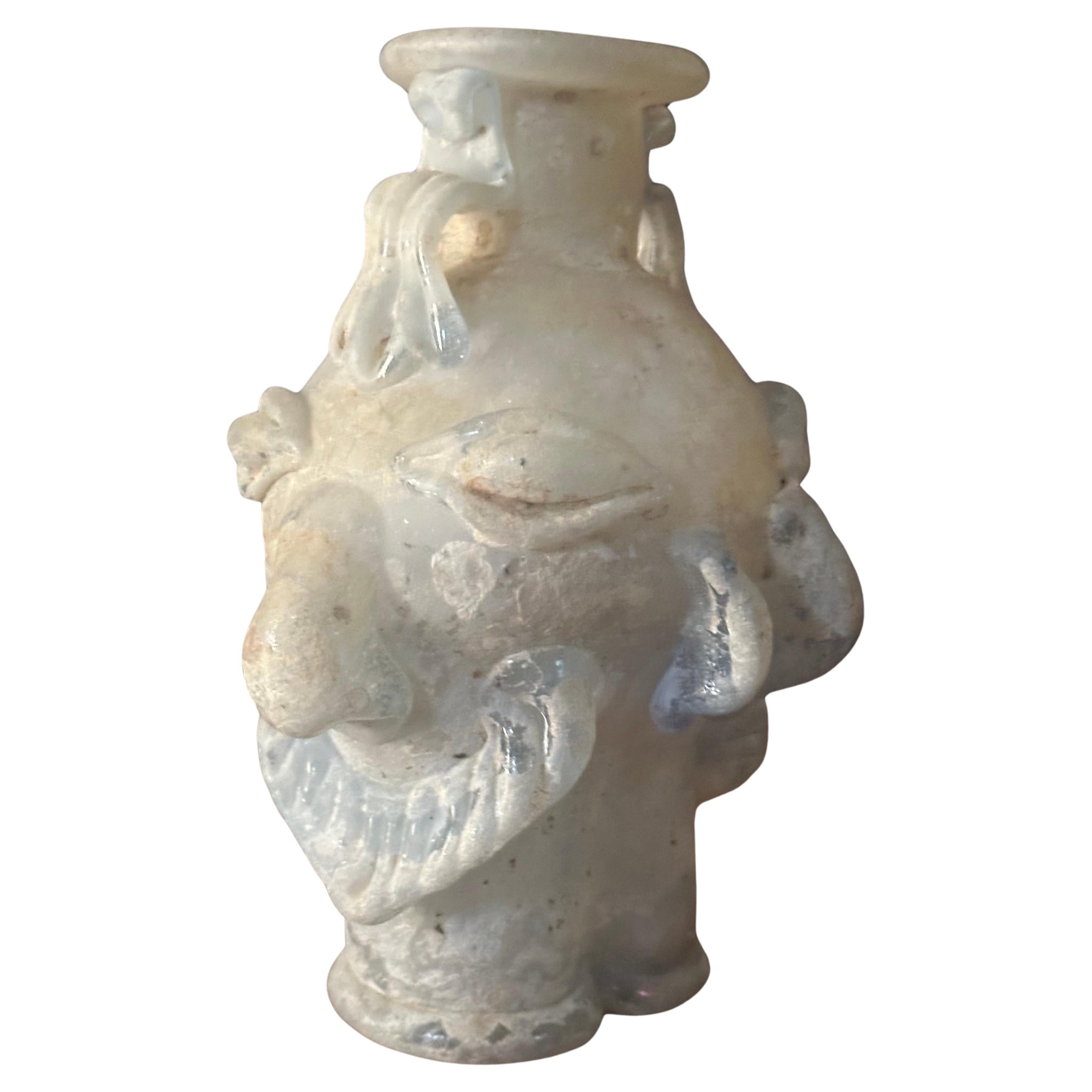 An interesting figural brutalist art glass vase, circa 1970s. It is the bust of a  man and has an abstract Picasso influenced look to it.  Very cool and different piece.  It is in very good condition with no chips or cracks and measures 5