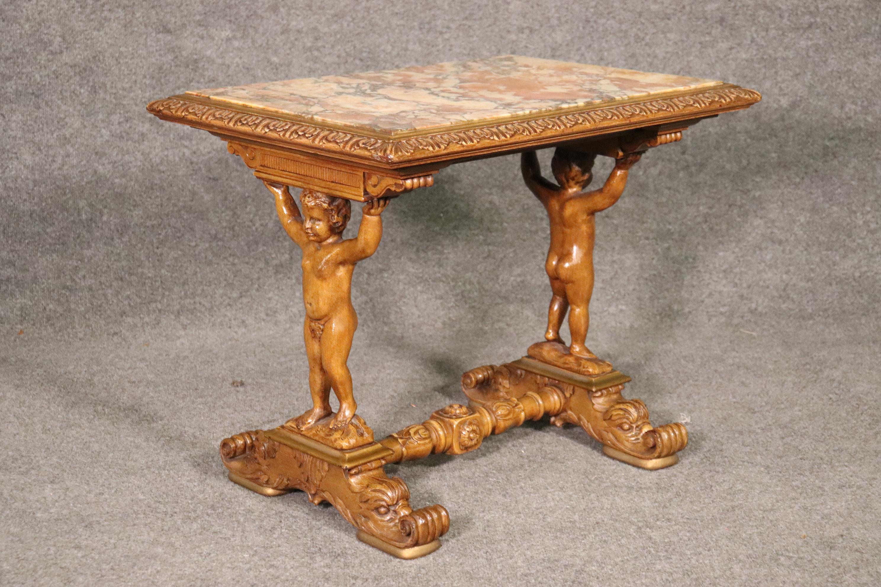 This is a gorgeous marbe top table made in Italy of incredible materialsand done incredibky well. Look the quality of the carving and condition. Measures 27 wide x 19 deep x 22 tall.