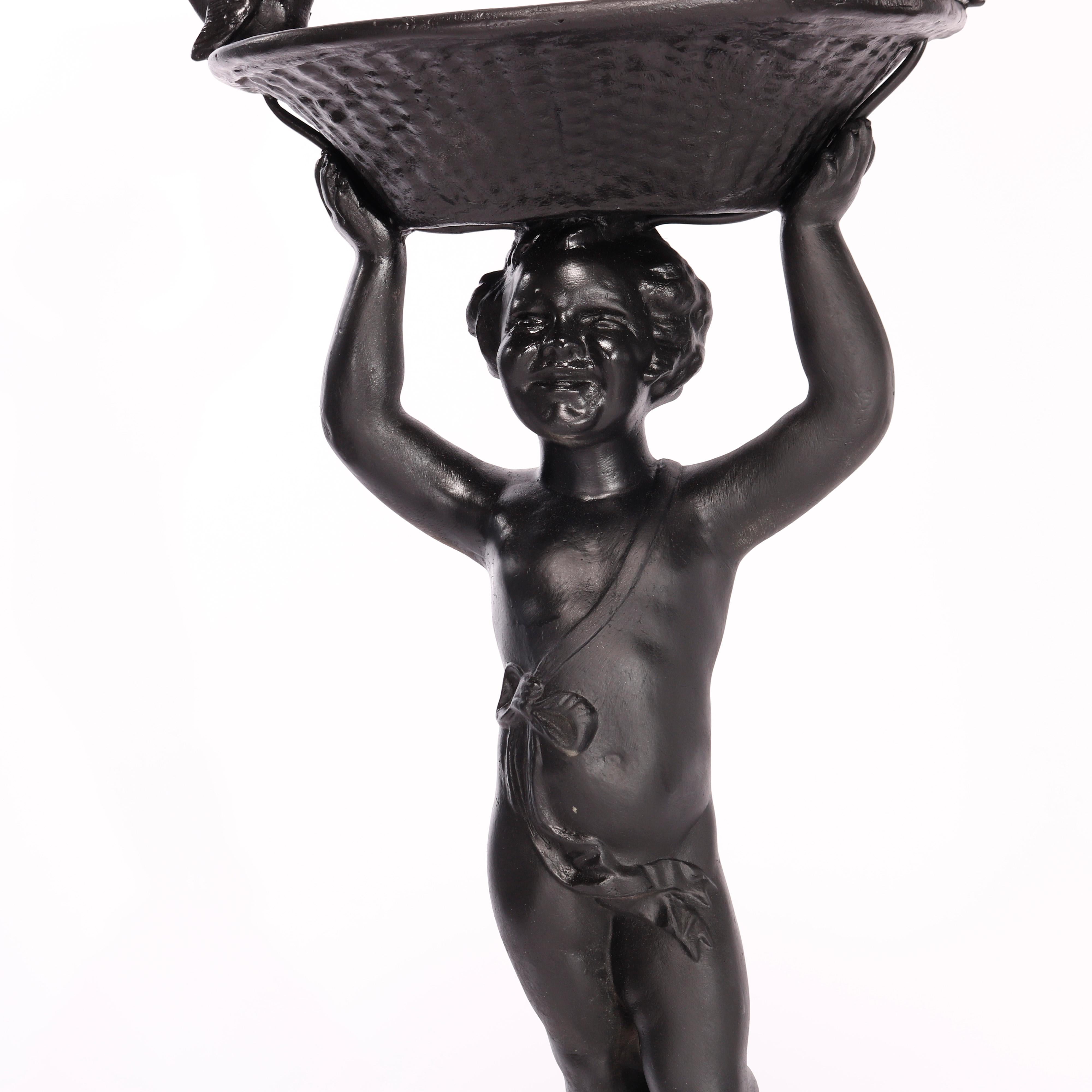A Figural Cast Iron Classical Cherub Fountain or Planter, 20th century

Measures - 51.5
