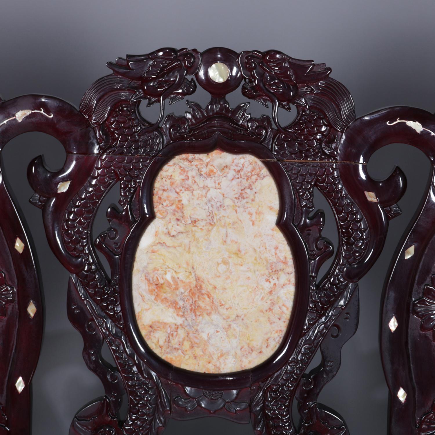 A set of four figural Chinese settee features inset marble seat and triptych back framed in dragons and having flanking scroll form supports with mother of pearl inlay featuring foliate elements surmounting hardwood base having carved foliate skirt