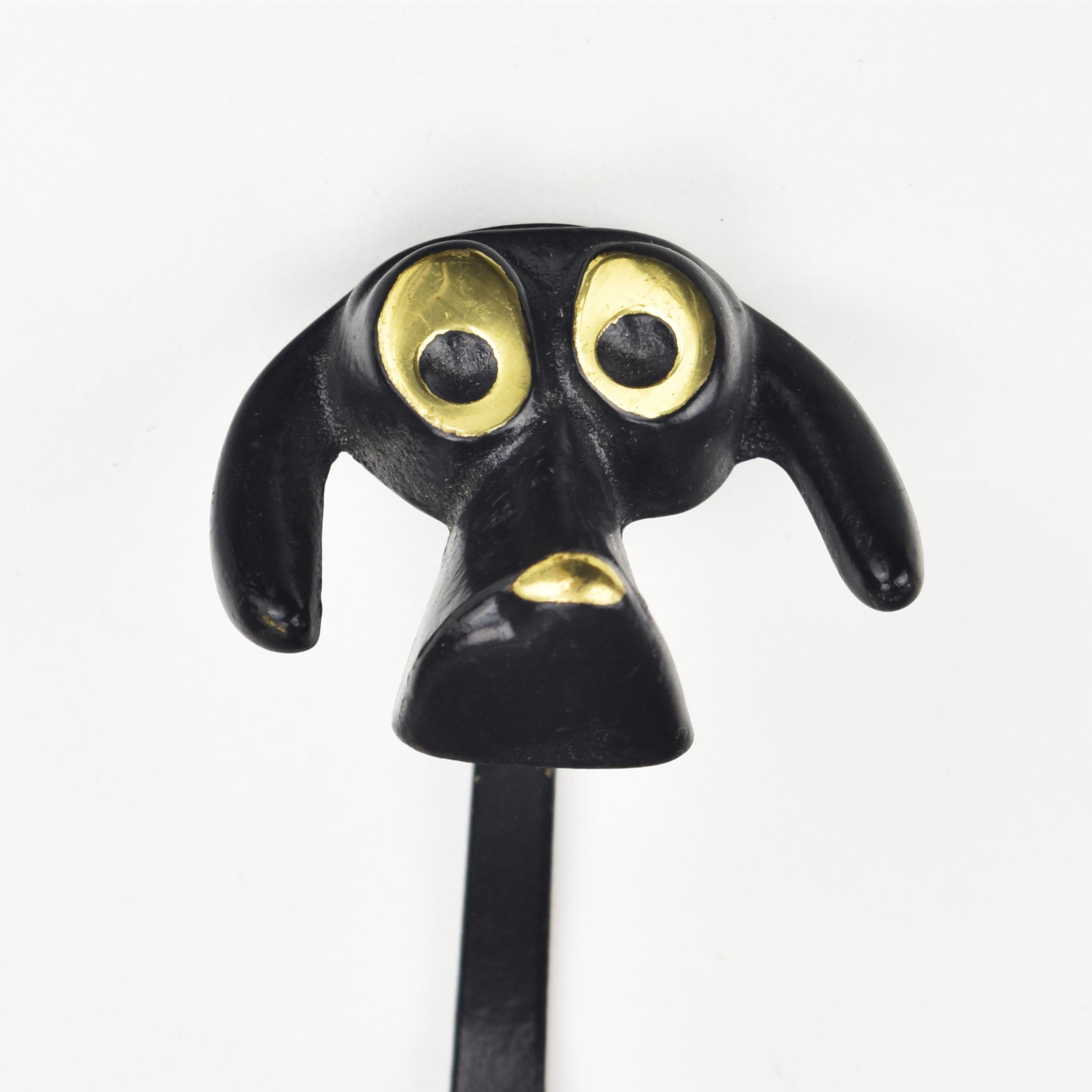 Iconic mid century modern black patinated brass or bronze figural dog coat hook, designed by Walter Bosse for Herta Baller in the 1950s/60s.