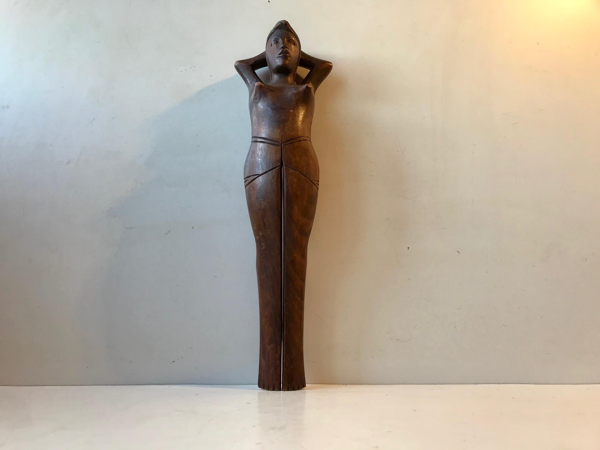 Large figural nutcracker in the shape of a young naked women. It’s made from hand carved oak and assembled without the use of metal. She has got some legs. The legs measures up 21 cm up the total length of 34 cm. It’s a Treen related Folk Art piece