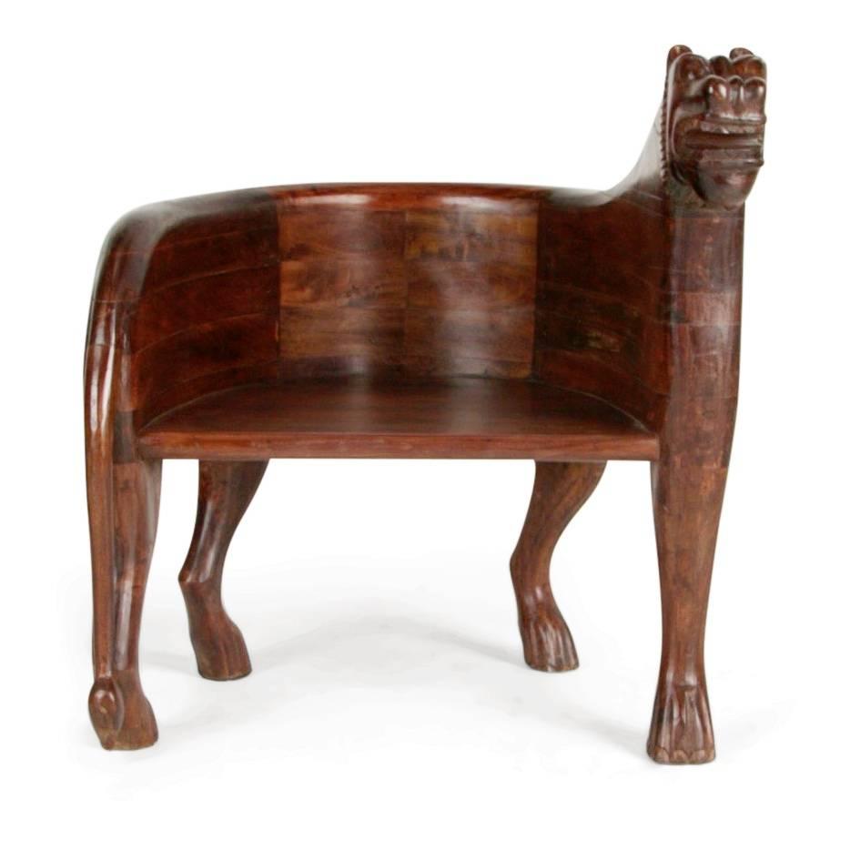 A spectacular and unique find, these two figural carved teak Lioness chairs are front-cover-magazine-worthy and can add a bit of the unexpected to any room style. Consider using a pair at the ends of an expansive dining table, in a living room or