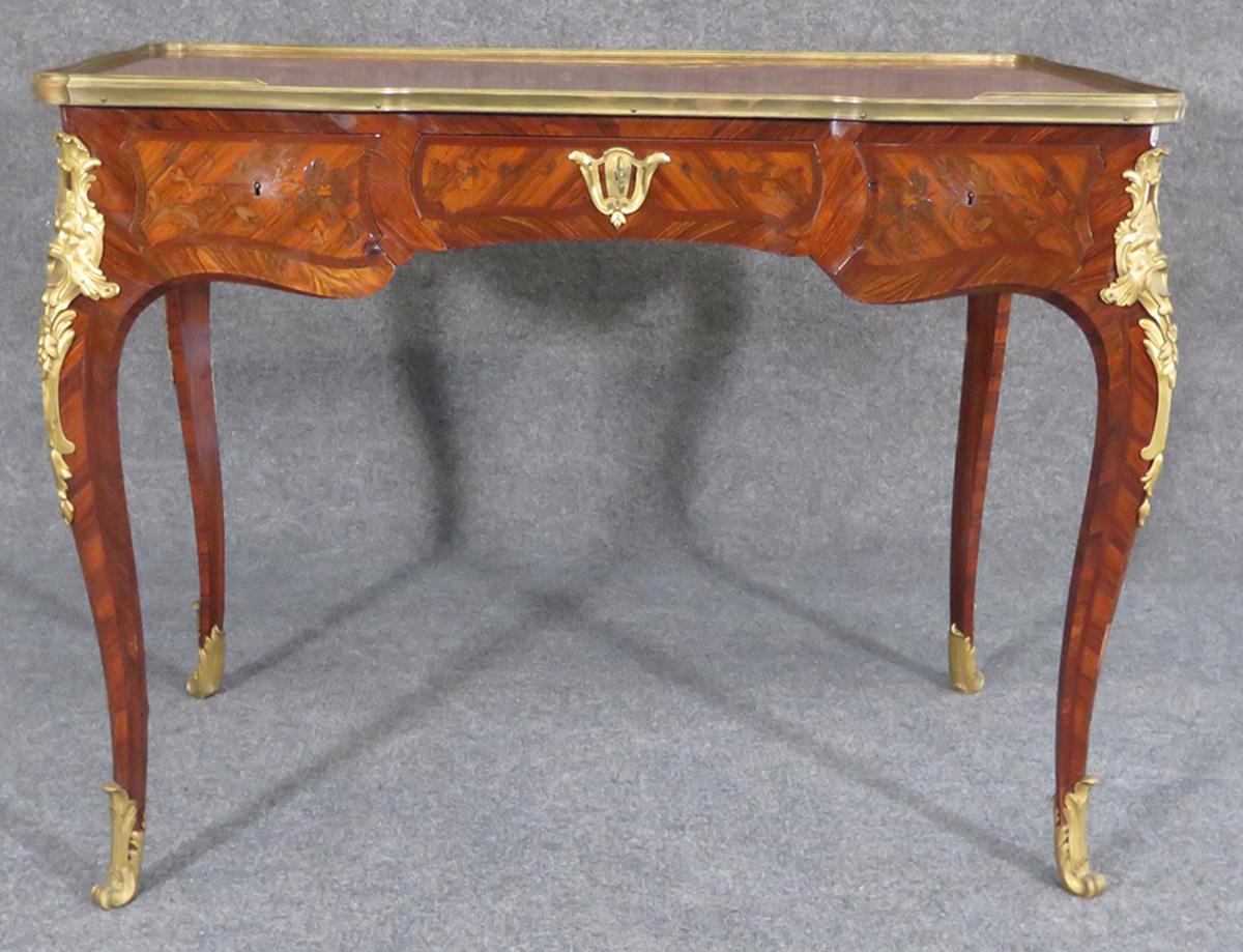 19th century bronze-mounted, inlaid bureau plat with three drawers. Measures: 29 3/4