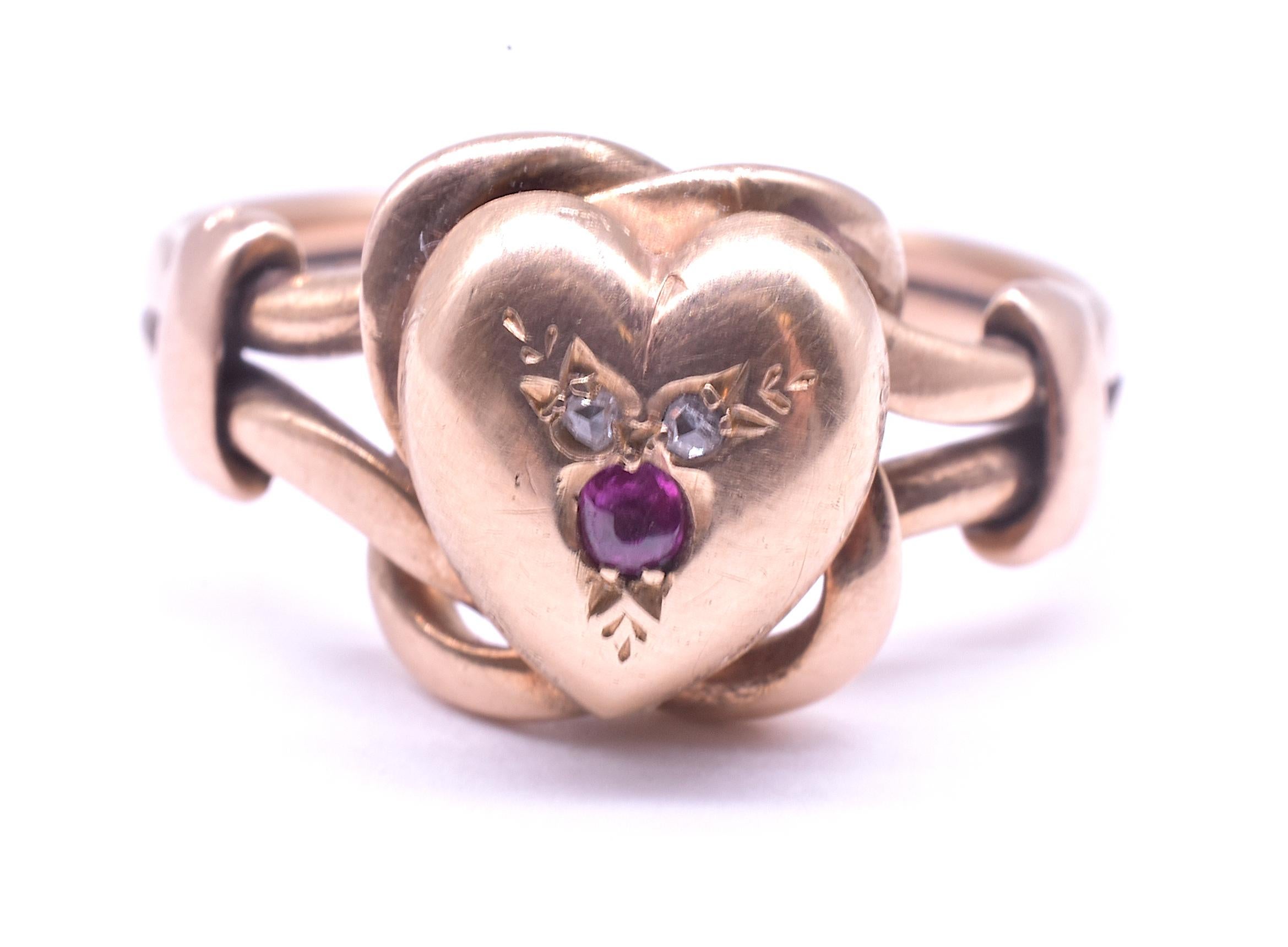 This is a romantic and sentimental version of the classic Victorian lover's knot ring, but you get a two-fer here; the classic lover's knot and a sweet gold heart both in one ring. This ring was made at the end of the Victorian era,  when