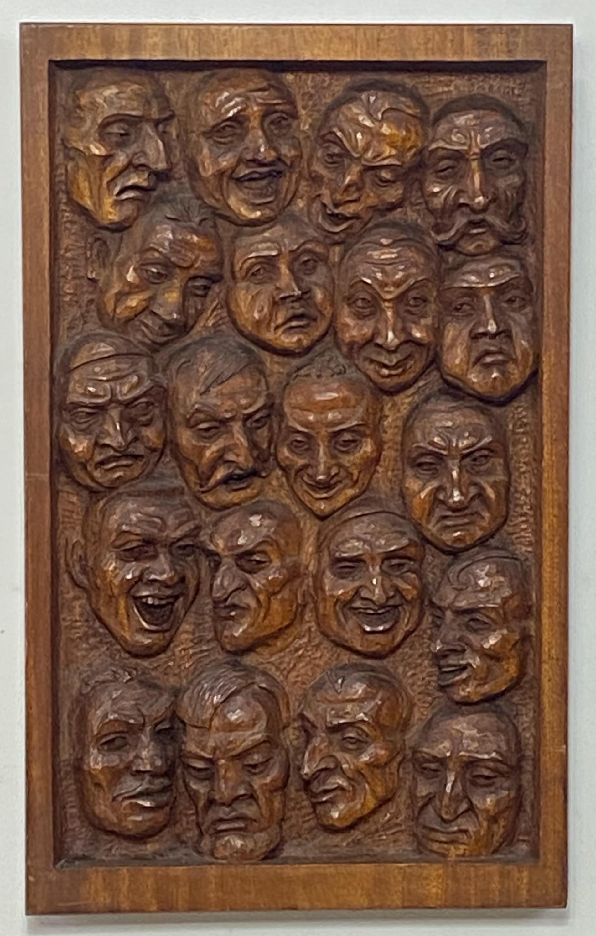 Outsider or Folk Art style relief carved mahogany wall sculpture. Carvings of 20 faces all with different expressions and emotions.
Signed Emil Janel and dated 1934.
Emil Gottfred Janel (1897 - 1981) was active/lived in California / Sweden. Emil