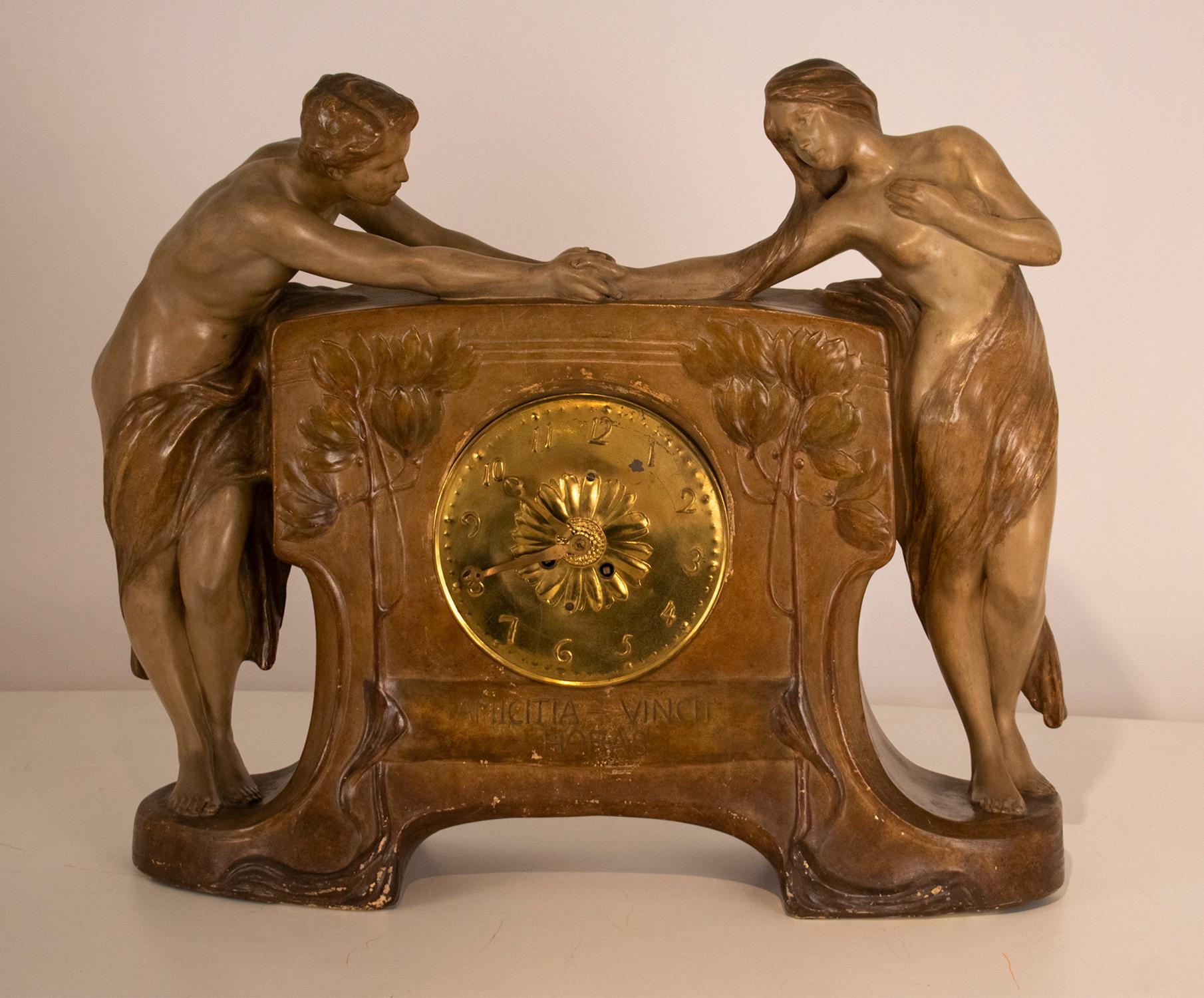 This lovely figural mantel clock by Goldscheider dates from the 1890s, and features the Latin saying on the face, 