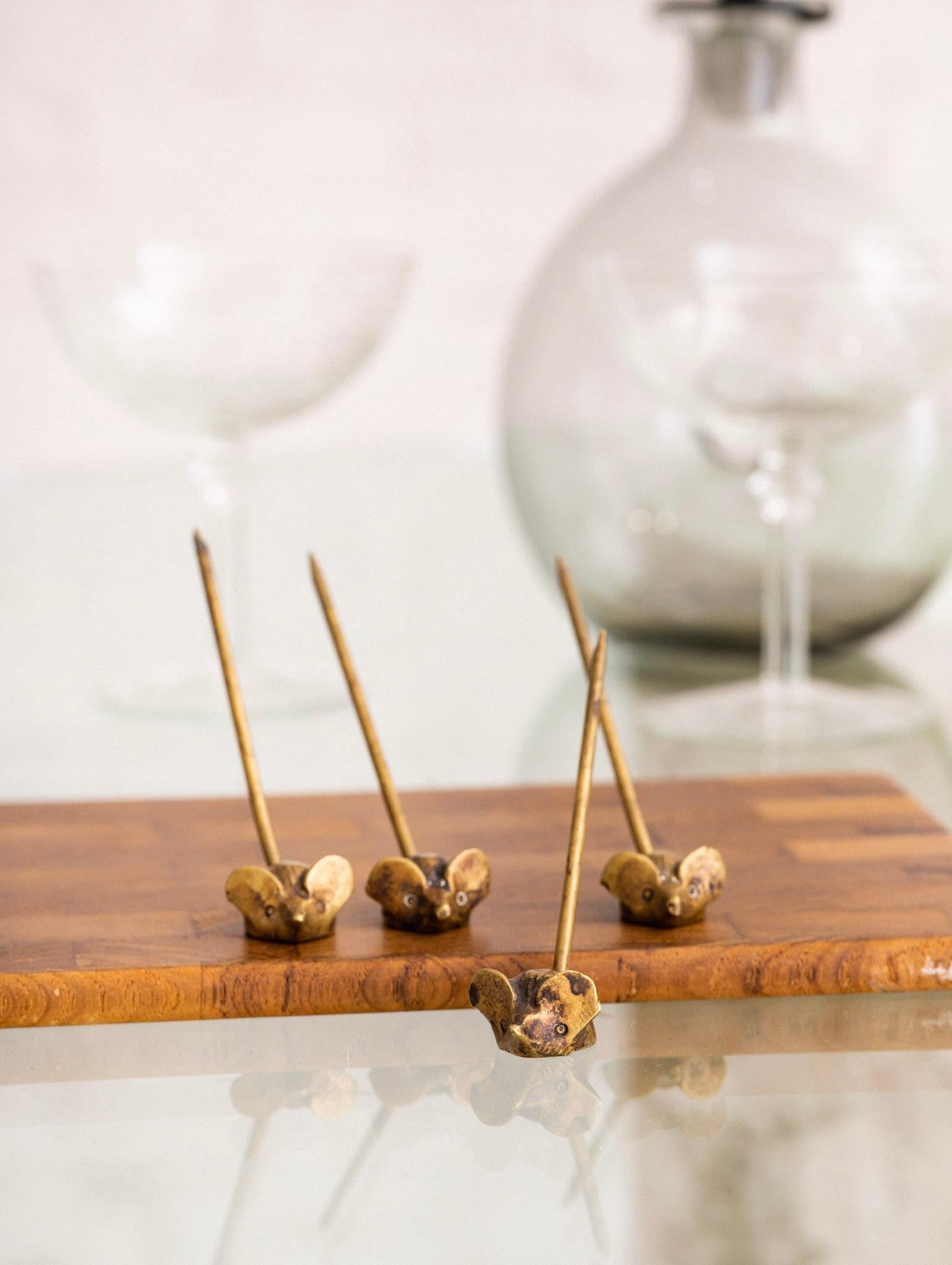 Whimsical set of brass serving picks. Mouse form with tail pick.
Dimensions are of individual pick.