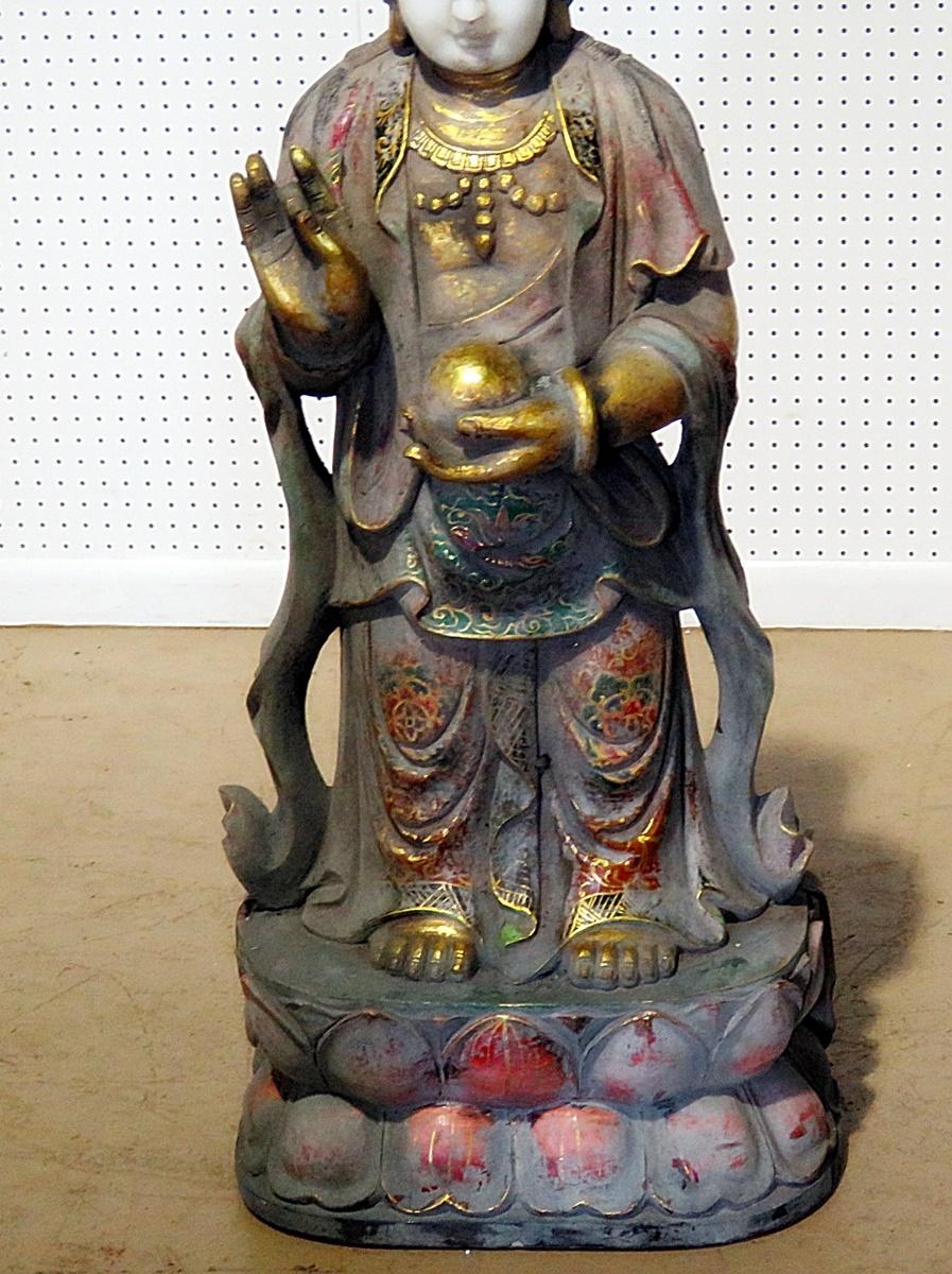 Figural oriental paint decorated statue.