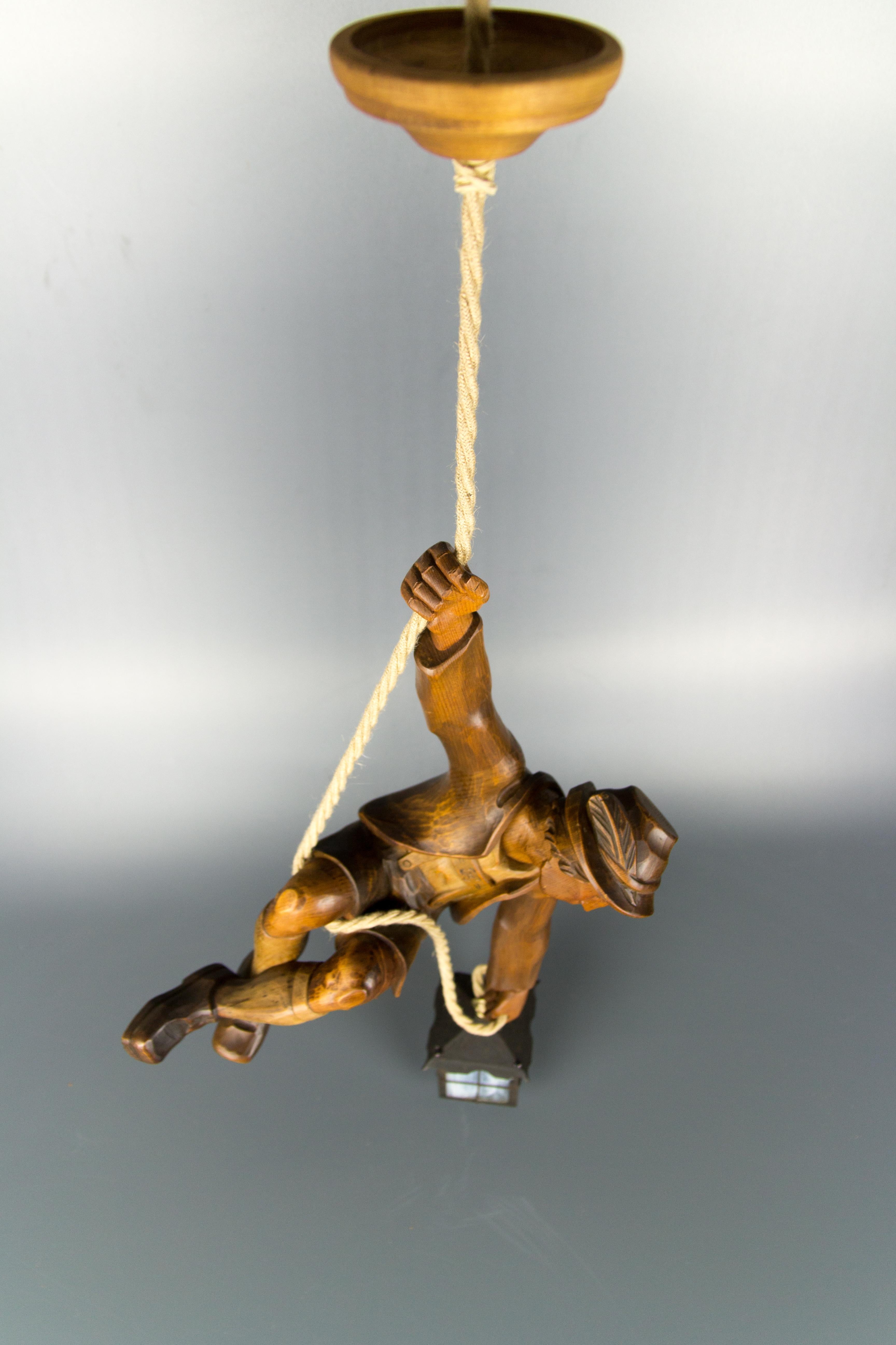 Figural Pendant Light of a Hand Carved Wood Figure Mountain Climber with Lantern 12