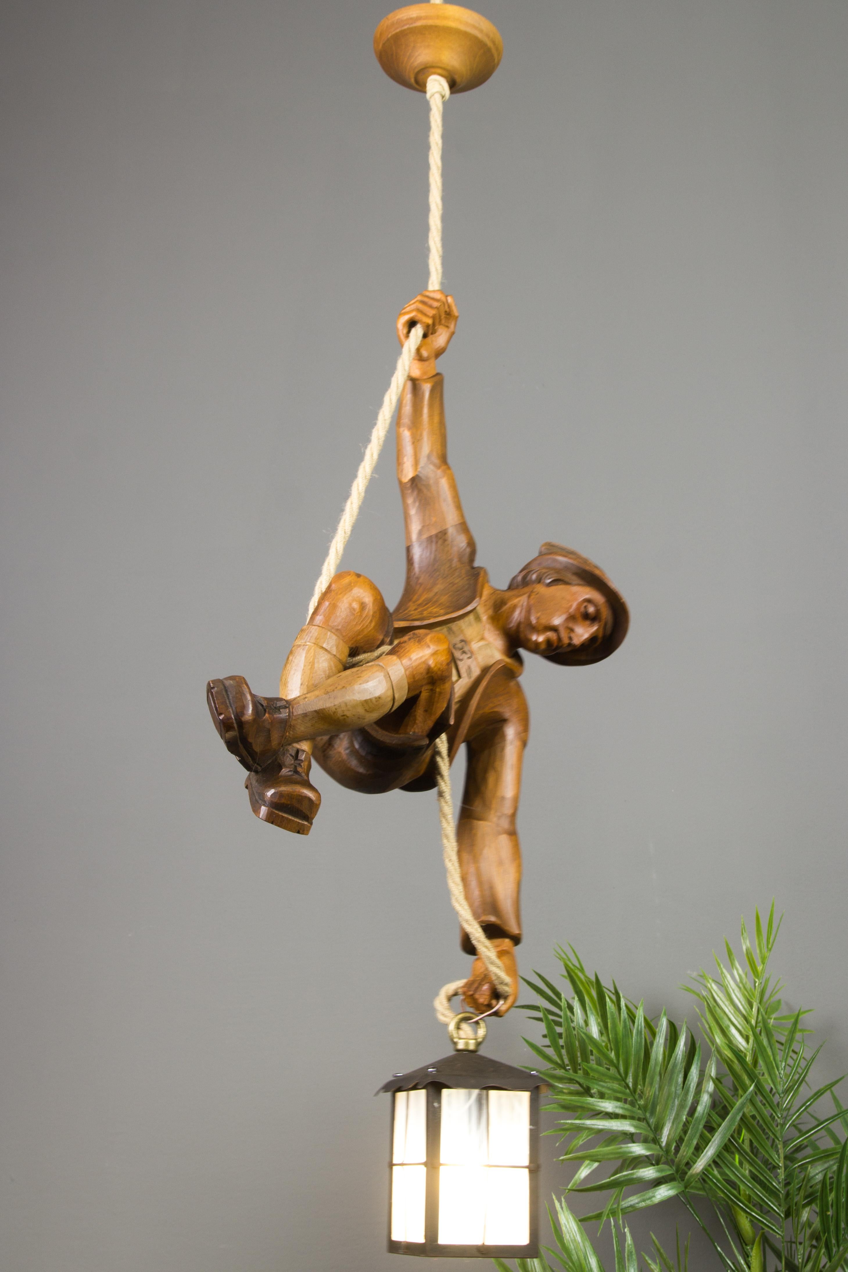 German Figural Pendant Light of a Hand Carved Wood Figure Mountain Climber with Lantern