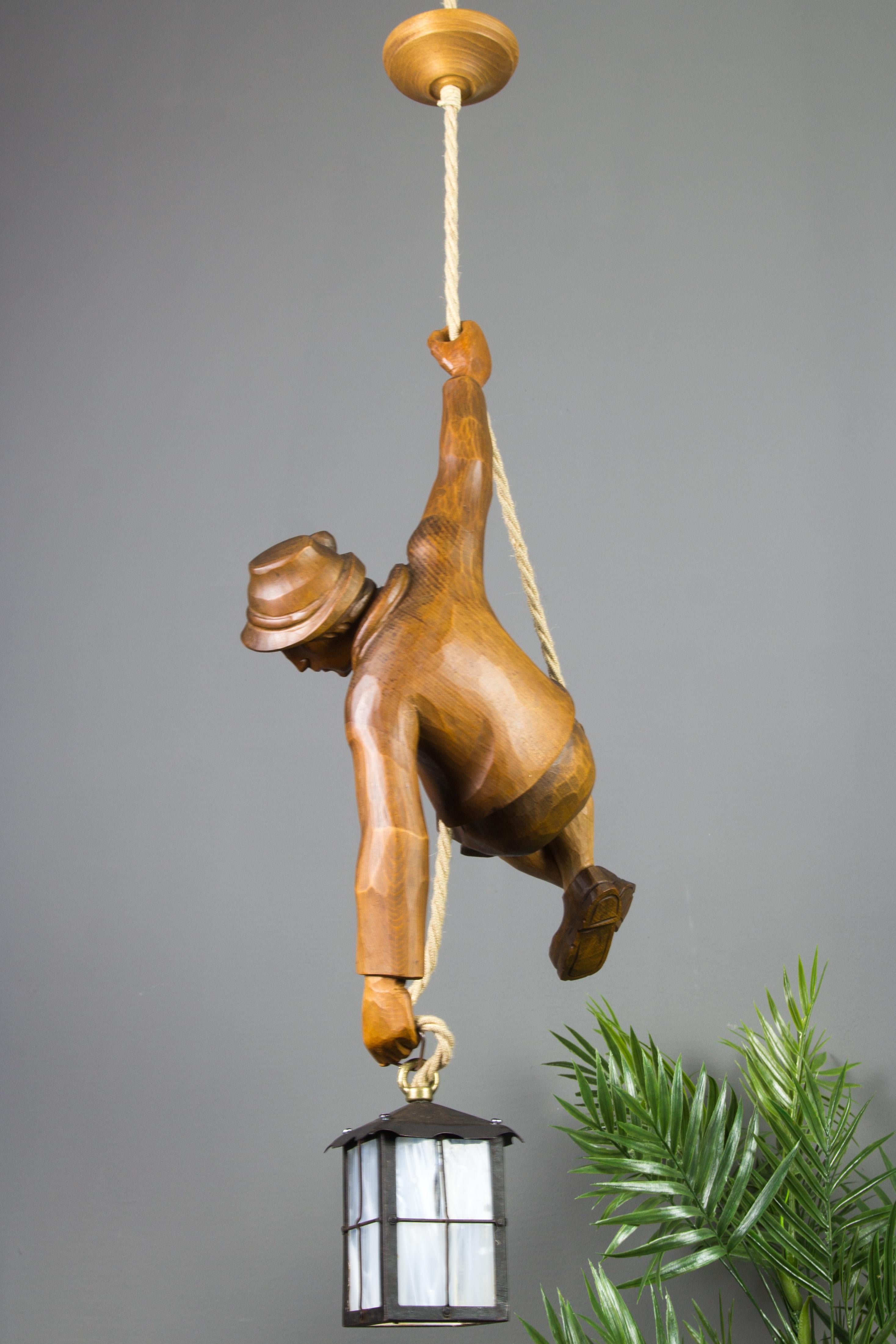 Mid-20th Century Figural Pendant Light of a Hand Carved Wood Figure Mountain Climber with Lantern