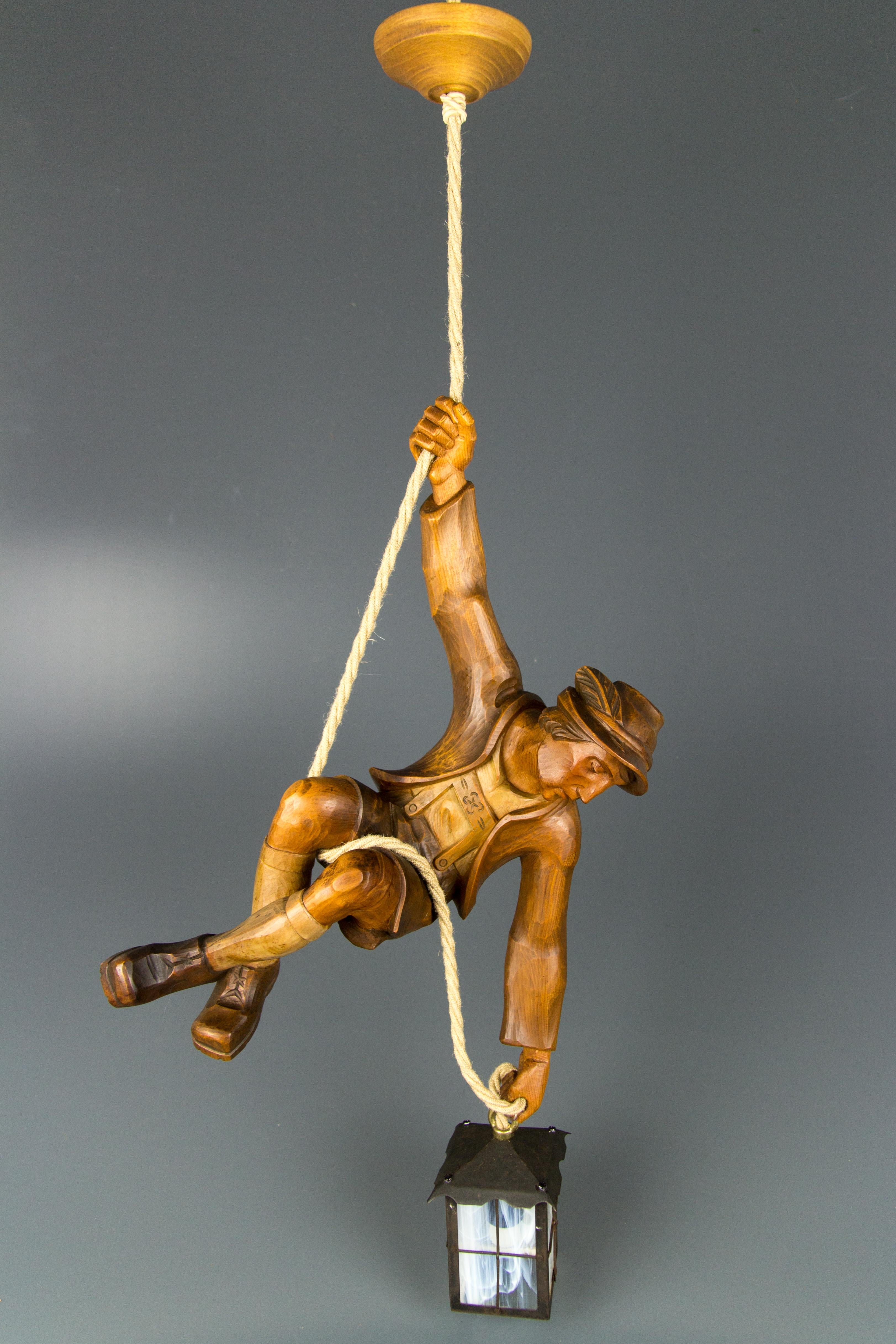 Figural Pendant Light of a Hand Carved Wood Figure Mountain Climber with Lantern 1