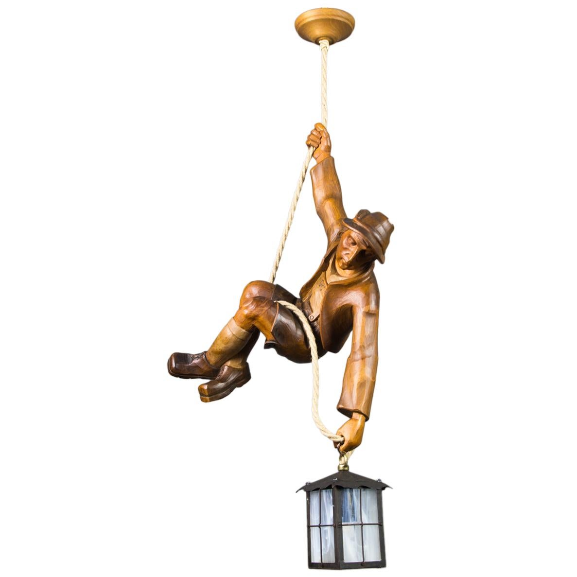 Figural Pendant Light of a Hand Carved Wood Figure Mountain Climber with Lantern