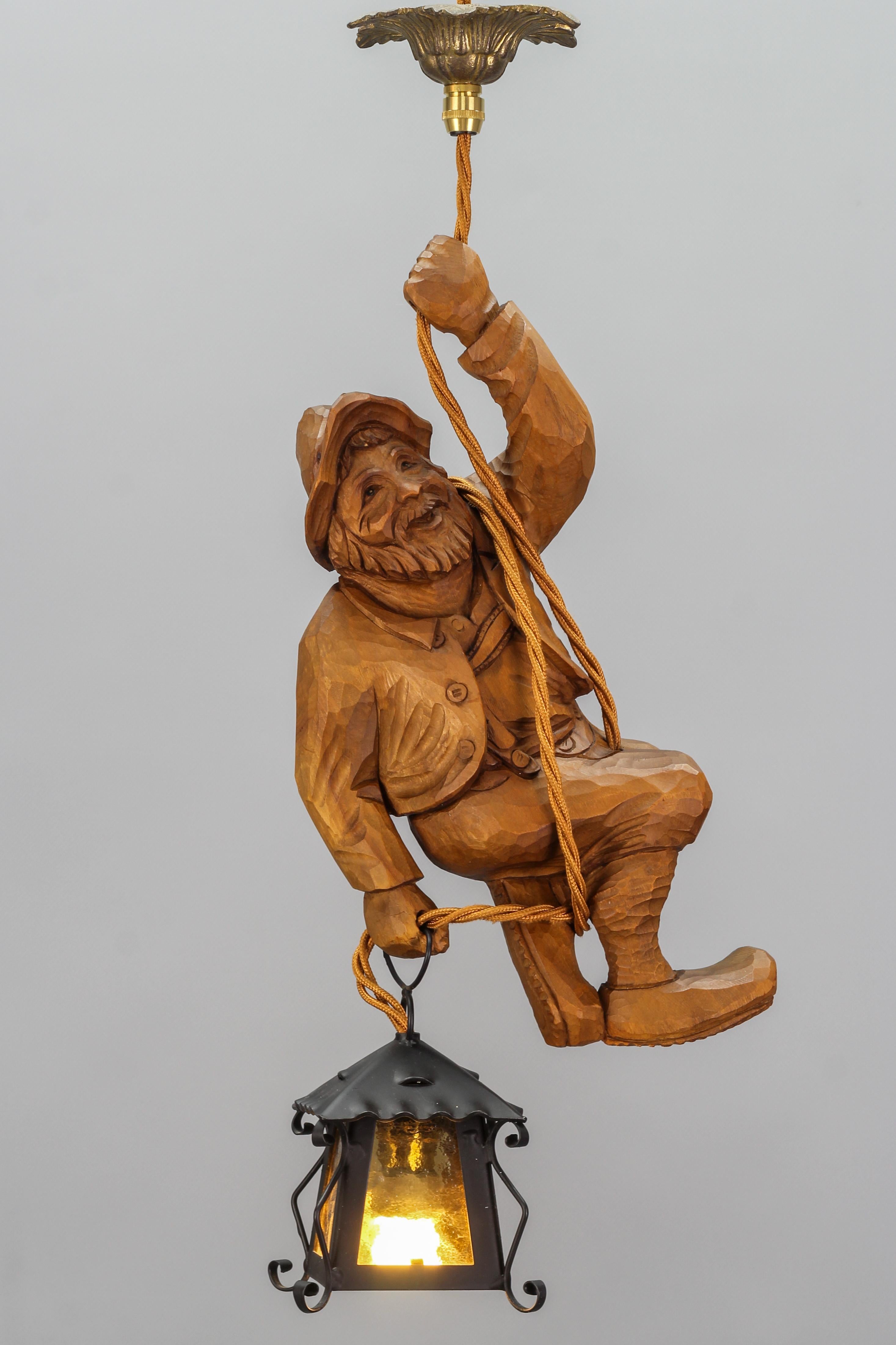 Black Forest Figural Pendant Light with a Carved Mountain Climber Figure and Lantern, Germany For Sale