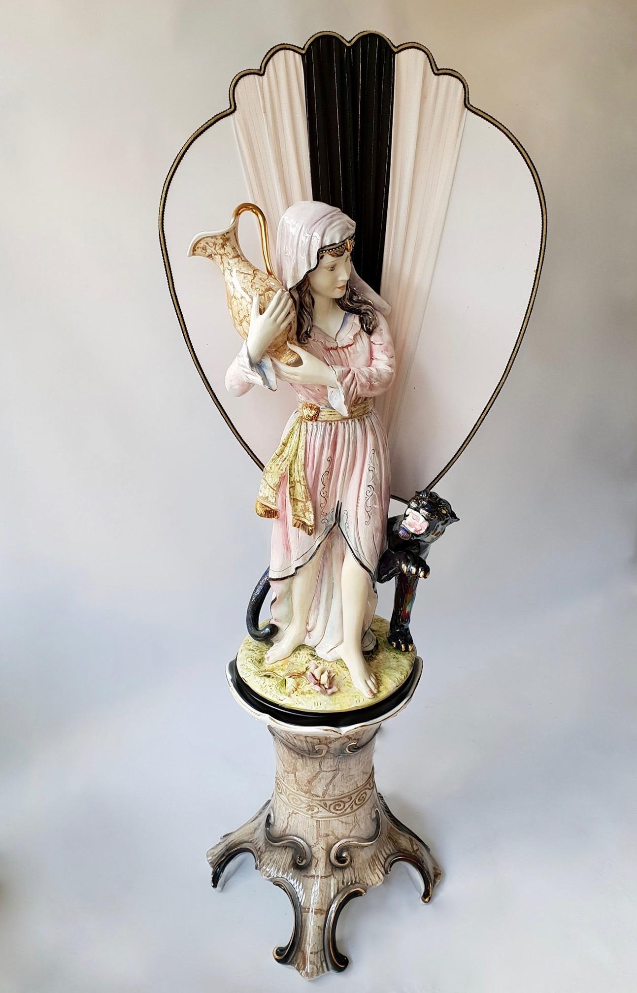 Italian porcelain floor lamp on a pedestal with a woman and panther.
Made in Italy 1970s and signed.
Measures: Height 174 cm.
Width 62 cm.
Depth 47 cm.
Height column 59 cm.
Width 47 cm. Depth 47 cm.
One E27 bulb.